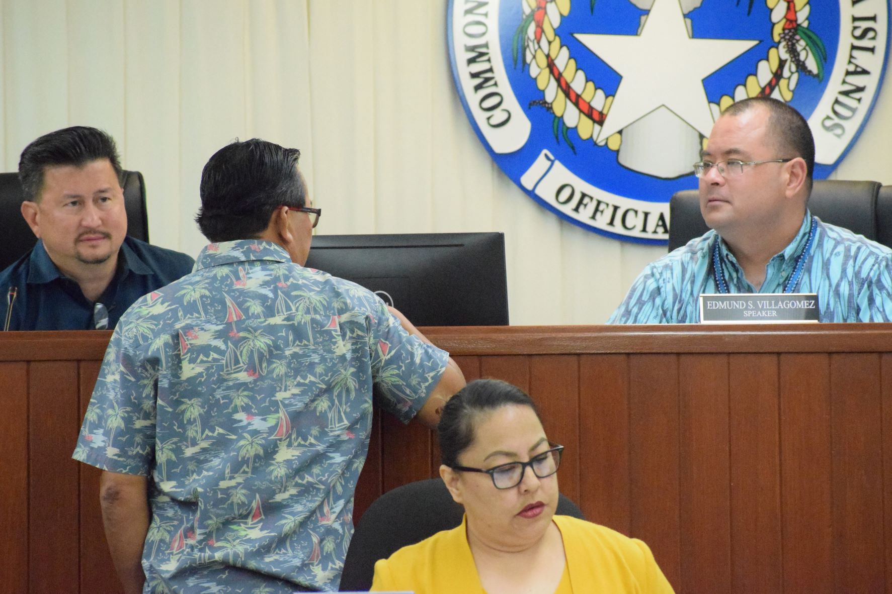 Saipan’s Speaker Edmund S. Villagomez, right, and House Floor Leader Edwin Propst, left, listen to Rep. Patrick San Nicolas of Tinian, back to the camera, during a break from a House session last week. Also in photo is House clerk Linda Muna.