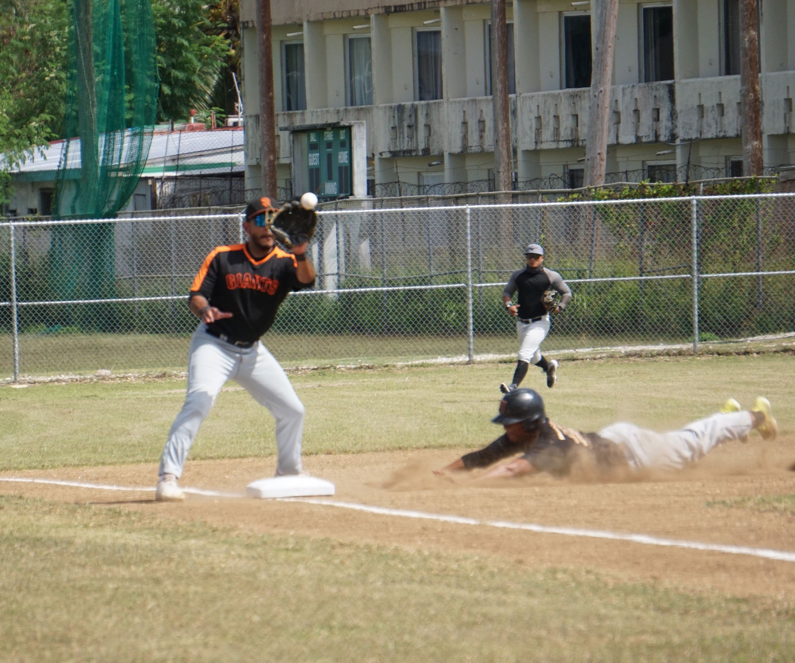 tHE CK Bears’ Shack Rangamar slides as he steals third base during the opening game against the Brewers in the Tan Holdings Saipan Baseball League at the Francisco "Tan Ko" Palacios Baseball Field on Saturday.