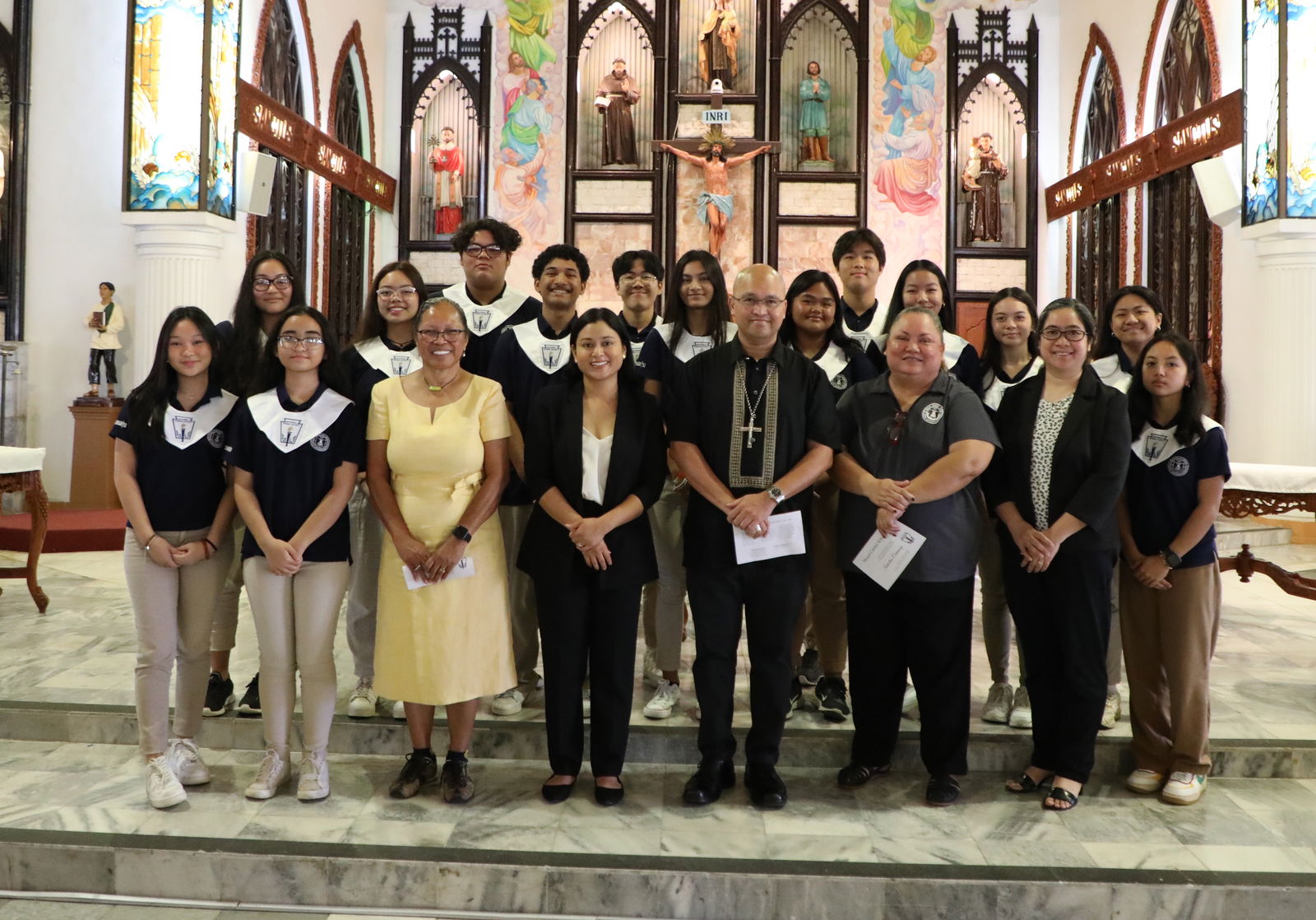 Fourteen high school students were inducted into Mount Carmel School’s Sacred Heart Chapter of the National Honor Society on Friday, March 10, 2023, at Mount Carmel Cathedral.