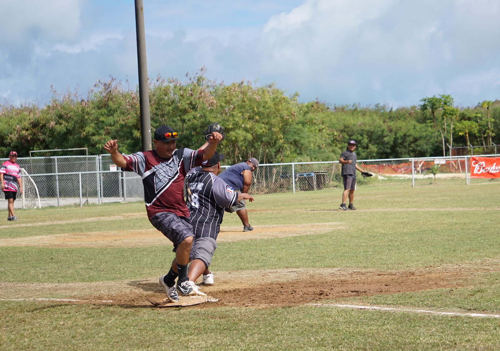 Sufa's Cavani Deleon Guerrero beats the ball to first base during a men's division game of the 2023 Budweiser Belau Amateur Softball League on Sunday at the Dandan baseball field.