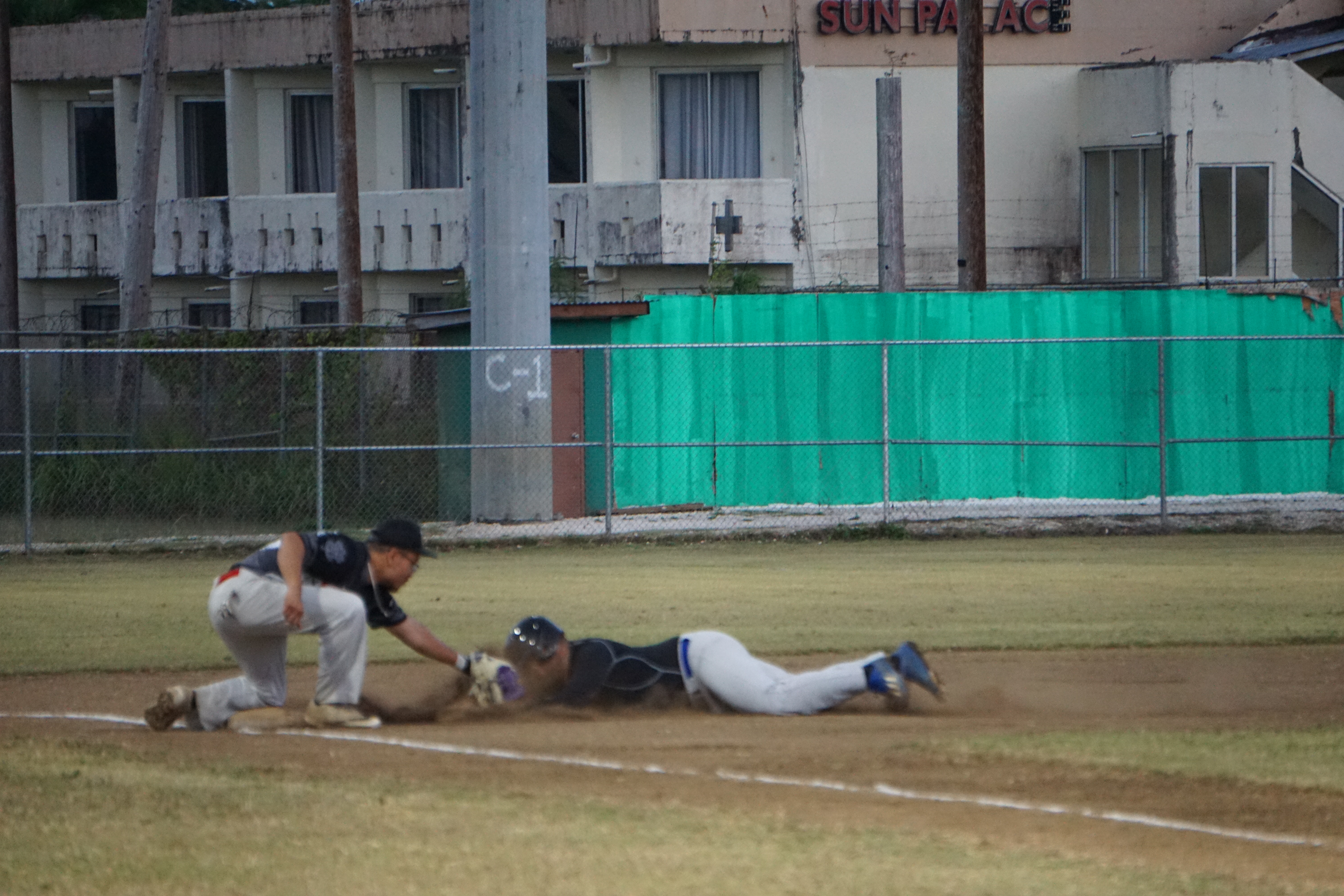 Falcons third baseman Ian Norita tags out a player attempting to  reach third base during a Tan Holdings Saipan Baseball League game Tuesday at the Francisco "Tan Ko" Palacios Baseball Field.