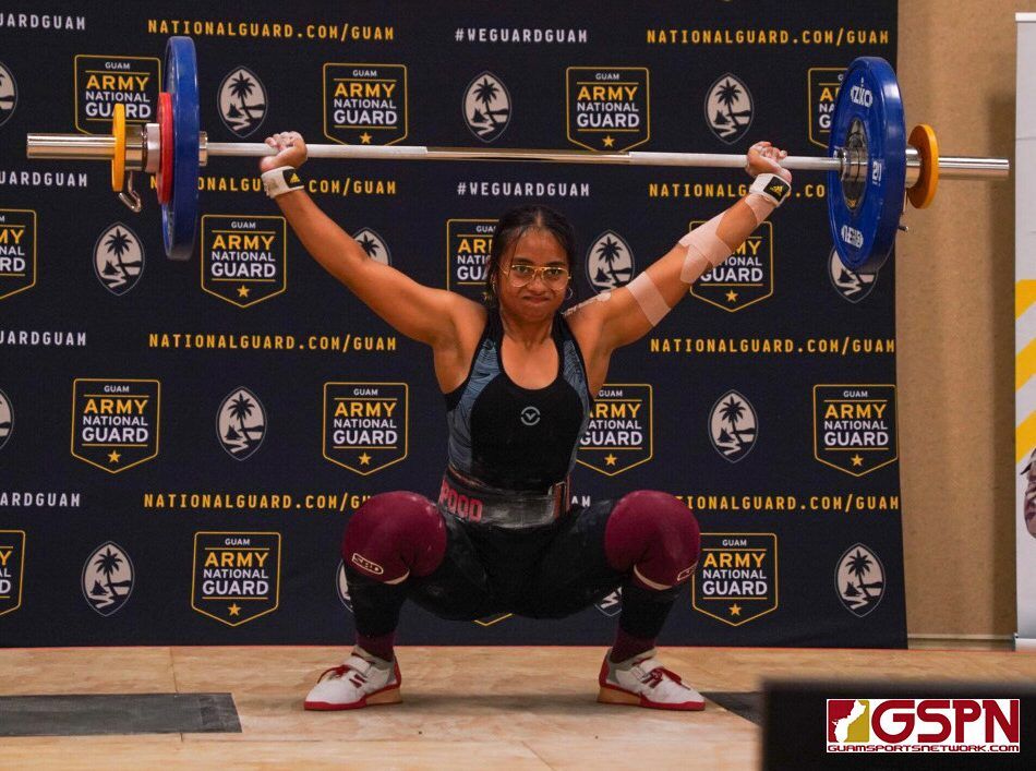 Anniegail Manuel attempts a lift in the snatch portion of the Olympic Weightlifting Championships on Guam Saturday.