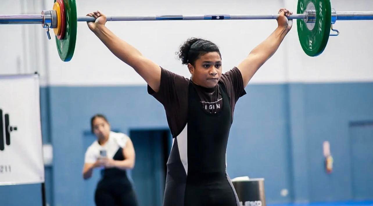 Aiden Gimed stands strong after completing the snatch during the qualifier competition hosted by CNMI Weightlifting in January.