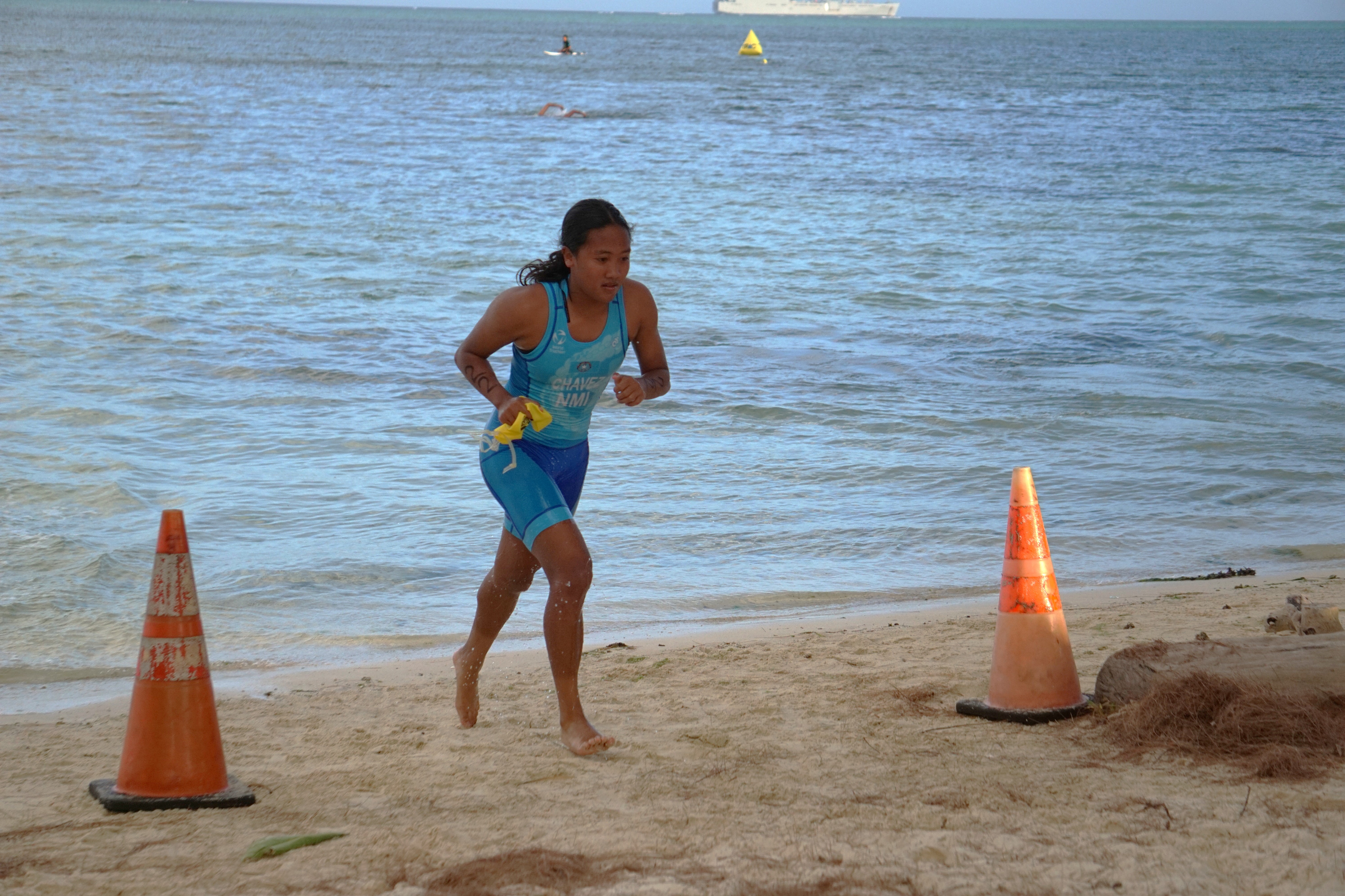 Kaithlyn Chavez makes her way to the transition from swimming to running during the TRAC’s 8th Aquathlon on Saturday in the Kilili Beach Park area.