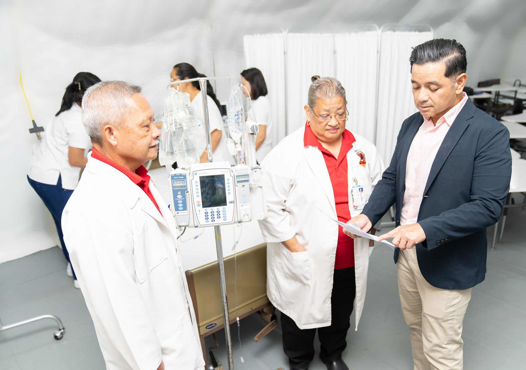 NMC Acting President and Vice President for Administration and Advancement Frankie Eliptico, right, meets with NMC Nursing Department Chair Rosa T. Aldan, center, and NMC nursing instructor Johnny Aldan, left, in one of the nursing classrooms to discuss plans to secure additional construction funding for a new regional healthcare training center. Through the assistance of Congressman Kilili, the college was able to obtain congressional funding for the architectural and engineering design for a healthcare training center.