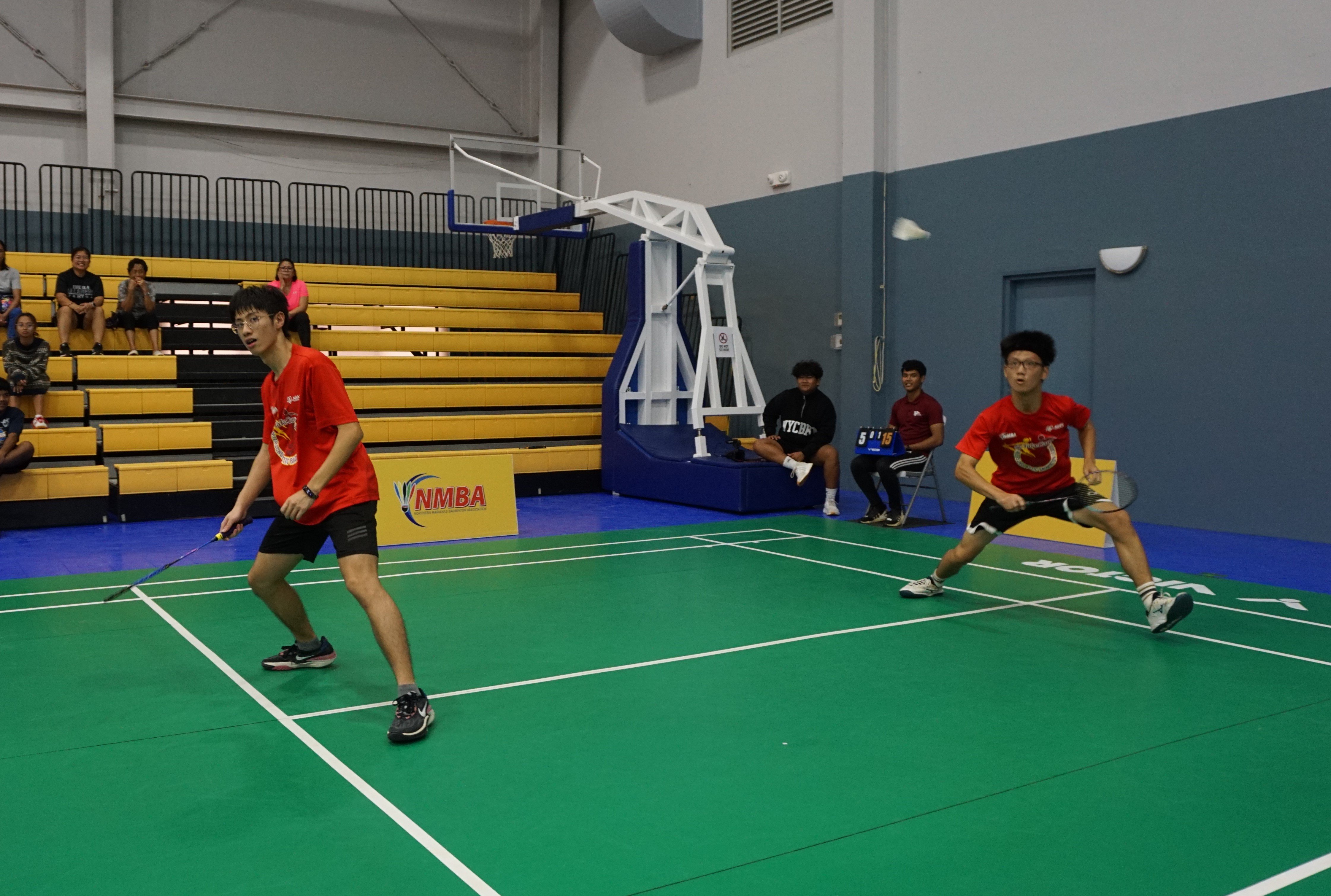 An ACS 1 player gathers for a return in the boys doubles event.