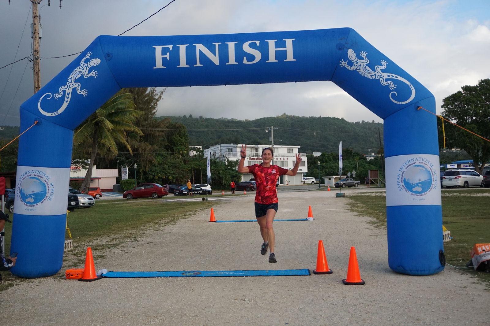 Lily Muldoon at the finish line of the CHCC Happy Hearts 5K '23 at the Garapan Fishing Base on Friday.