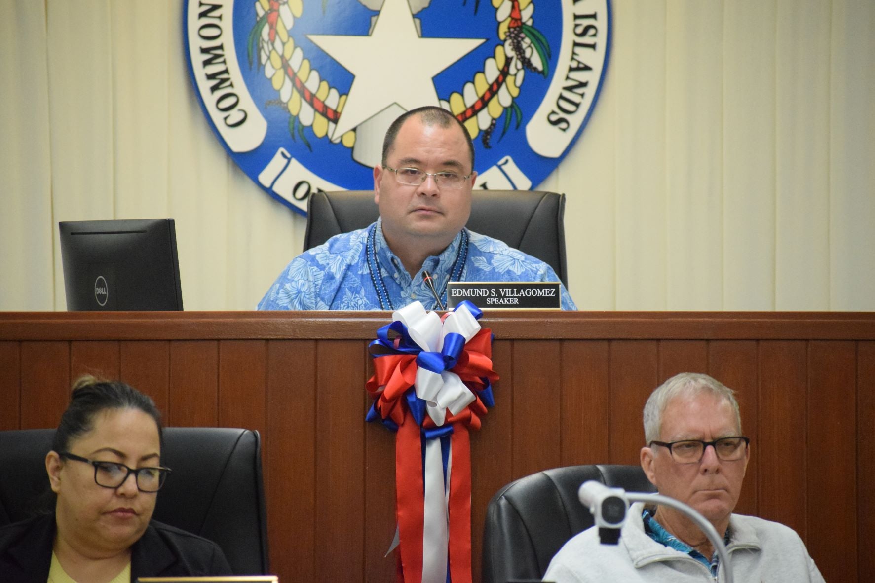 House legal counsel John Bradley, right, with Speaker Edmund S. Villagomez, center, and House clerk Linda Muna, left, in the House chamber during a House session.