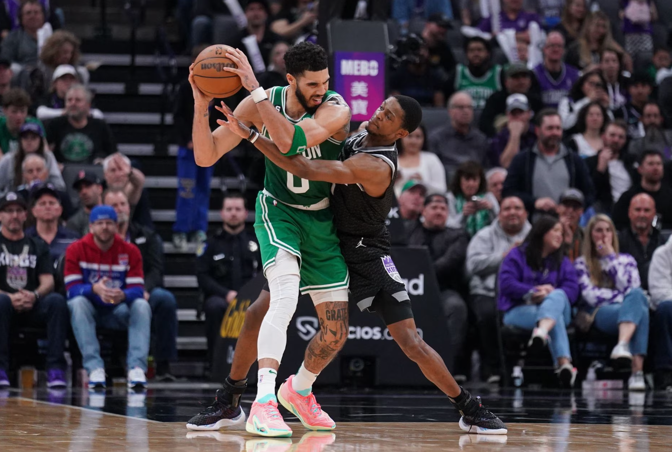 Boston Celtics forward Jayson Tatum (0) is defended by Sacramento Kings guard De'Aaron Fox (5) in the third quarter at the Golden 1 Center in Sacramento, California, March 21, 2023.