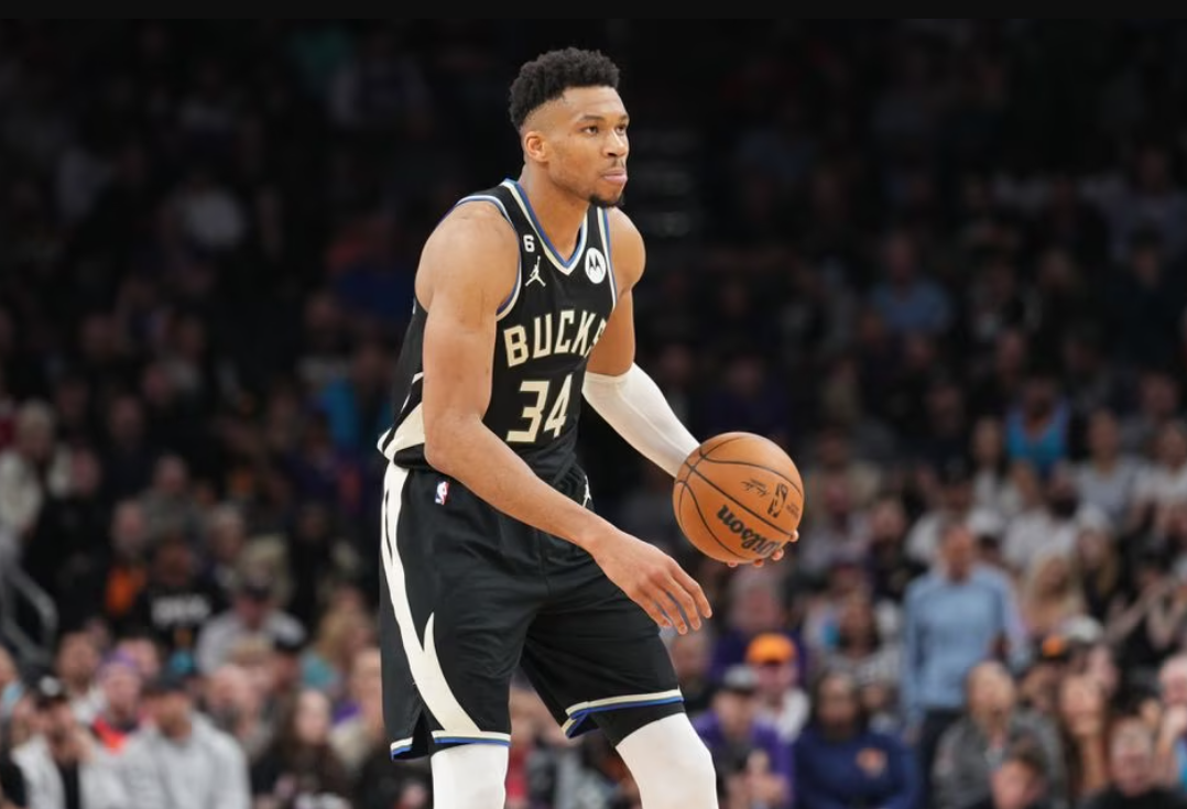 Milwaukee Bucks forward Giannis Antetokounmpo (34) dribbles against the Phoenix Suns during the second half at Footprint Center in Phoenix, Arizona, March 14, 2023.