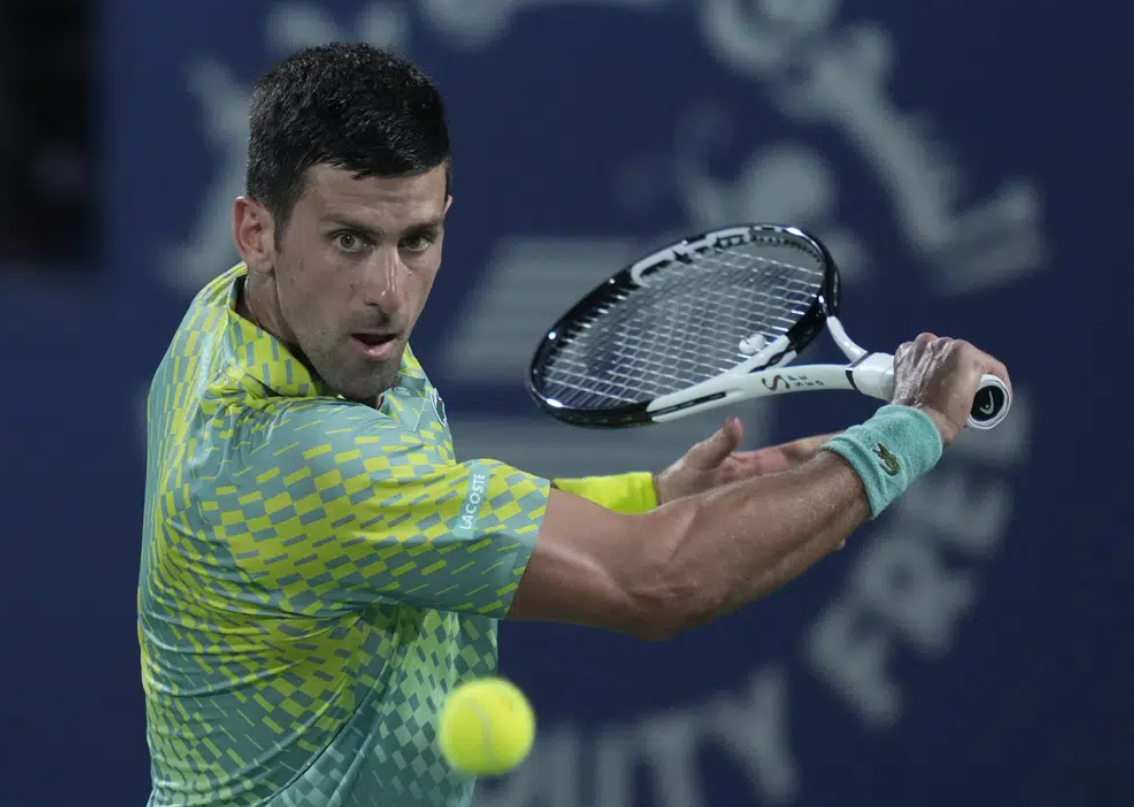 Serbia's Novak Djokovic returns the ball to Daniil Medvedev during their semifinal match of the Dubai Duty Free Tennis Championships in Dubai, United Arab Emirates, Friday, March 2, 2023.