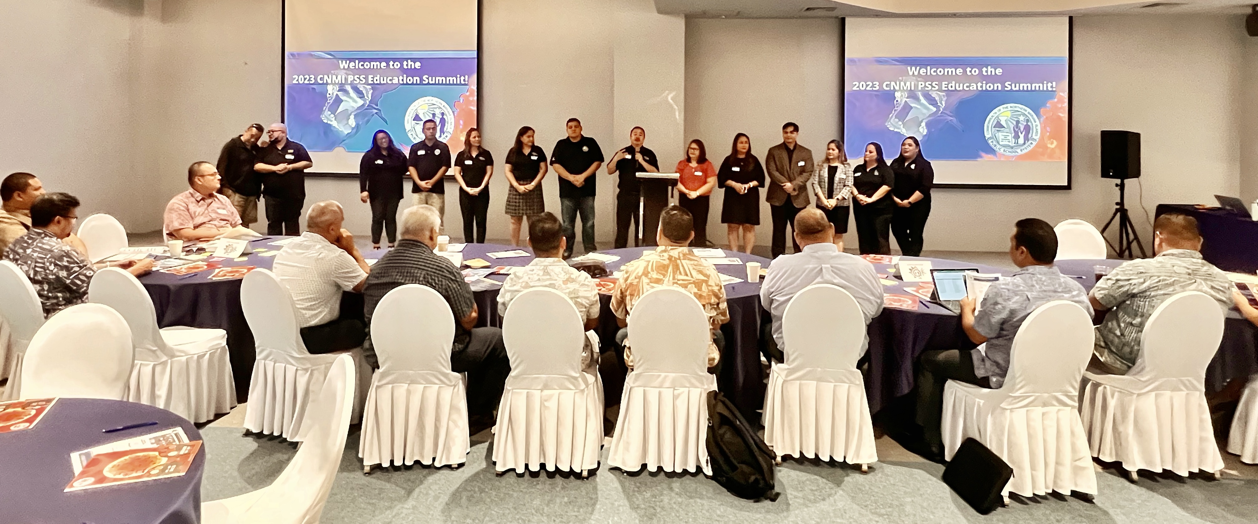 Commissioner of Education Dr. Alfred B. Ada introduces the Public School System’s leadership team during a summit with lawmakers on Friday at Kensington Hotel.