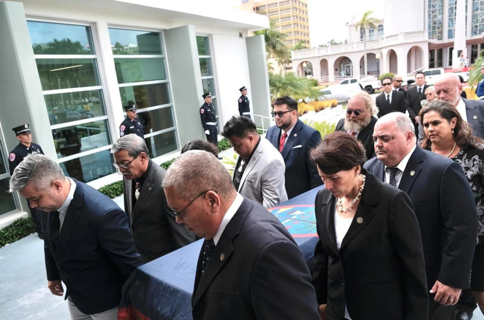 Members of the 37th Guam Legislature bring in the casket of former Sen. Benigno Palomo during his memorial service Wednesday, April 26, 2023, at the Guam Congress Building in Hagåtña. 