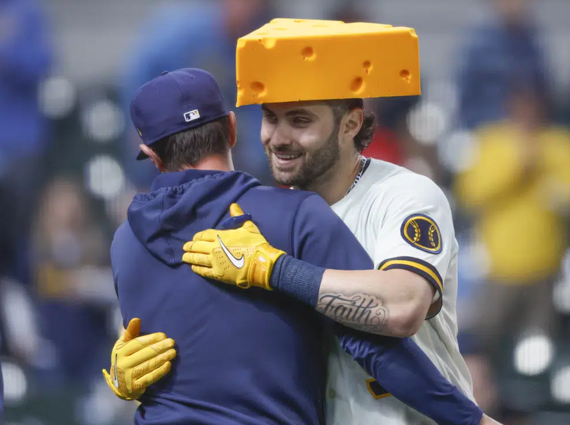 Milwaukee Brewers' Garrett Mitchell, right, is congratulated after hitting the game-winning home run during the ninth inning of a baseball game against the New York Mets Wednesday, April 5, 2023, in Milwaukee. The Brewers won 7-6.