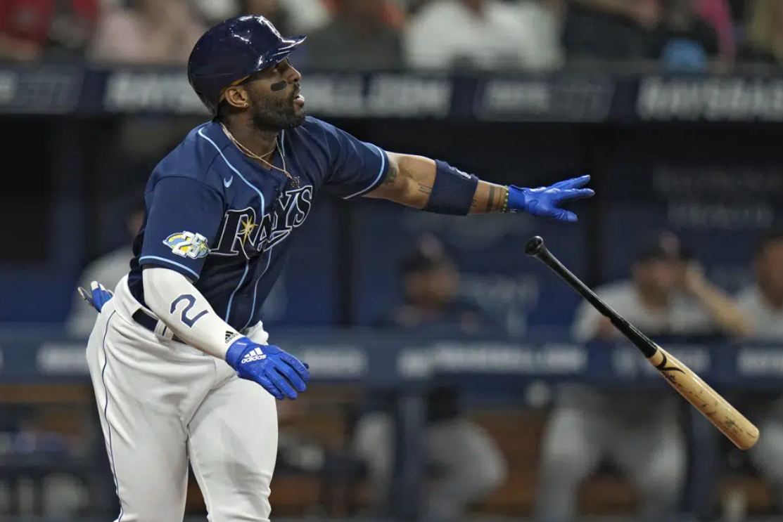 Tampa Bay Rays' Yandy Diaz watches his run-scoring sacrifice fly off Boston Red Sox starting pitcher Chris Sale during the fourth inning of a baseball game Wednesday, April 12, 2023, in St. Petersburg, Fla. Rays' Taylor Walls scored on the play.
