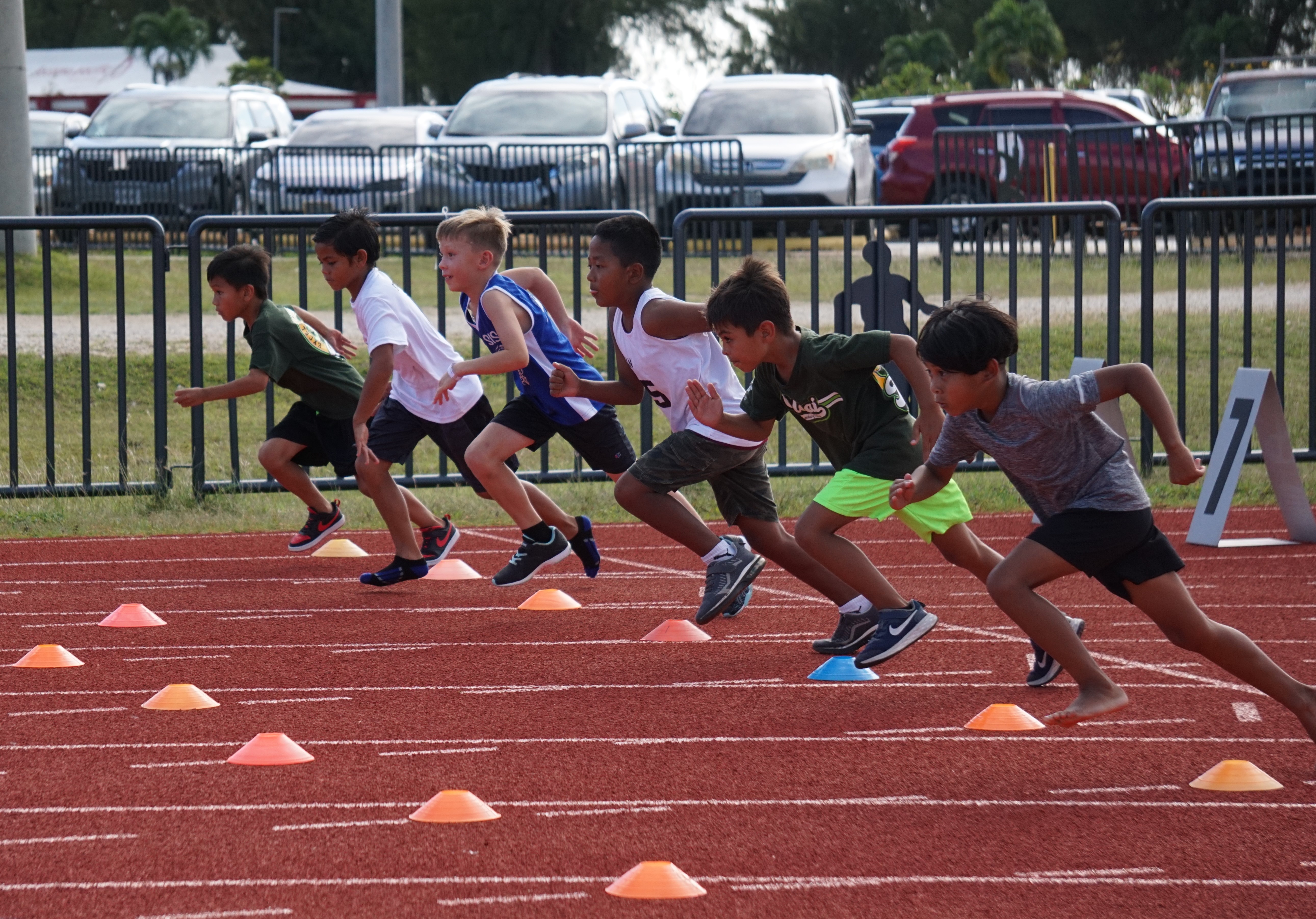 Runners take off during a U9 Boys 100m event of the PSS-NMA All School Athletics on Friday at the Oleai Sports Complex.