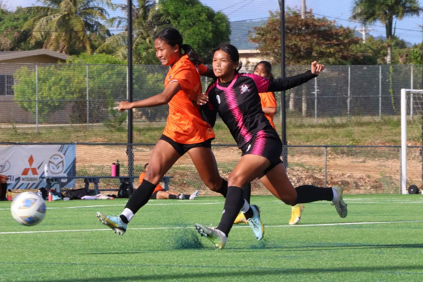 Southern United Football Club's Summer Manahane attempts the interception against a Kanoa Football Club player during a U17 girls division game of the TakeCare Youth Soccer League at the NMI Soccer Training Center in Koblerville.