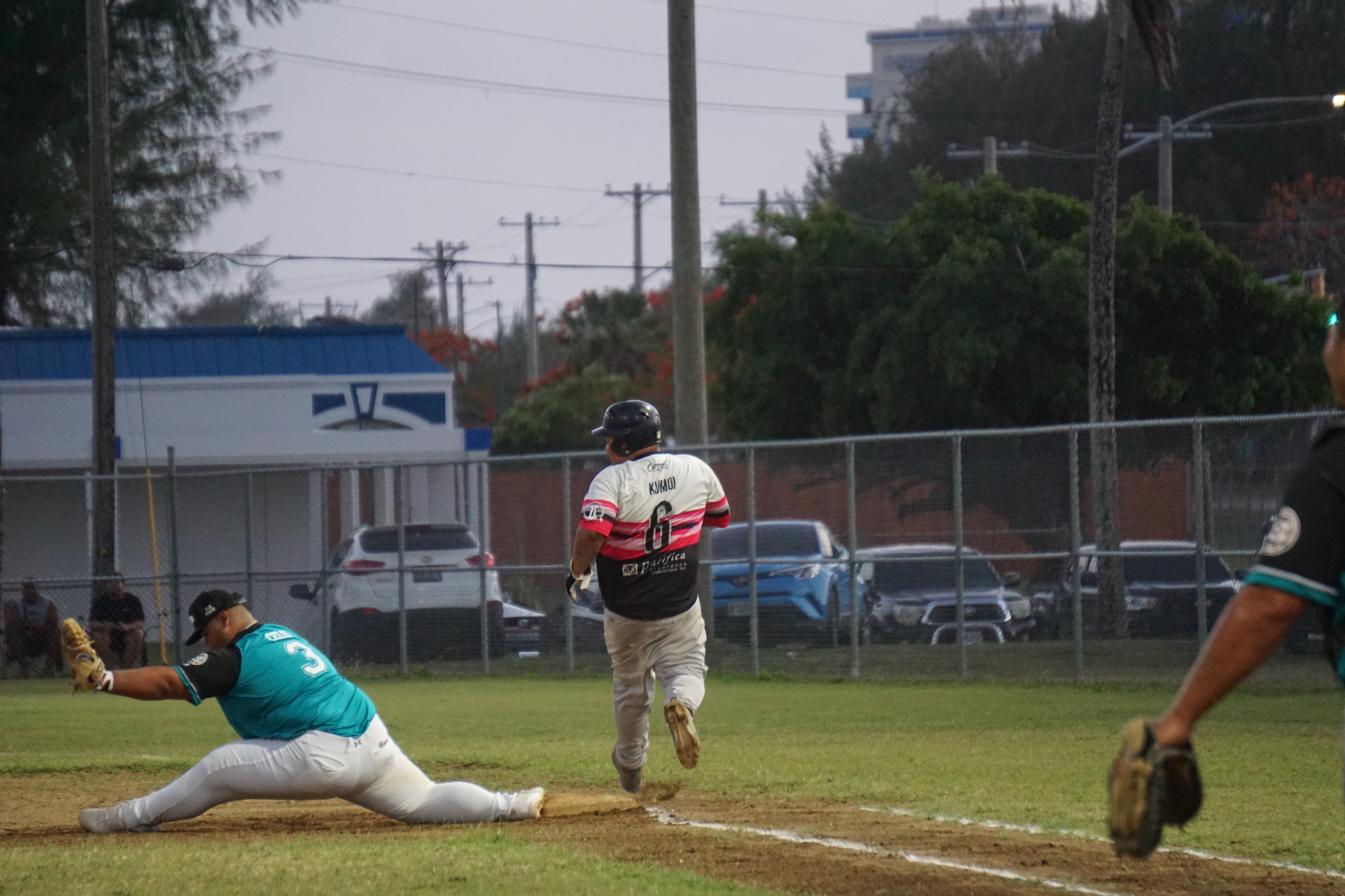 D-9er's first baseman Patrick Celis reaches out to beat a runner for the out during a Tan Holdings Saipan Baseball League game Tuesday at the Francisco "Tan Ko" Palacios Baseball Field.