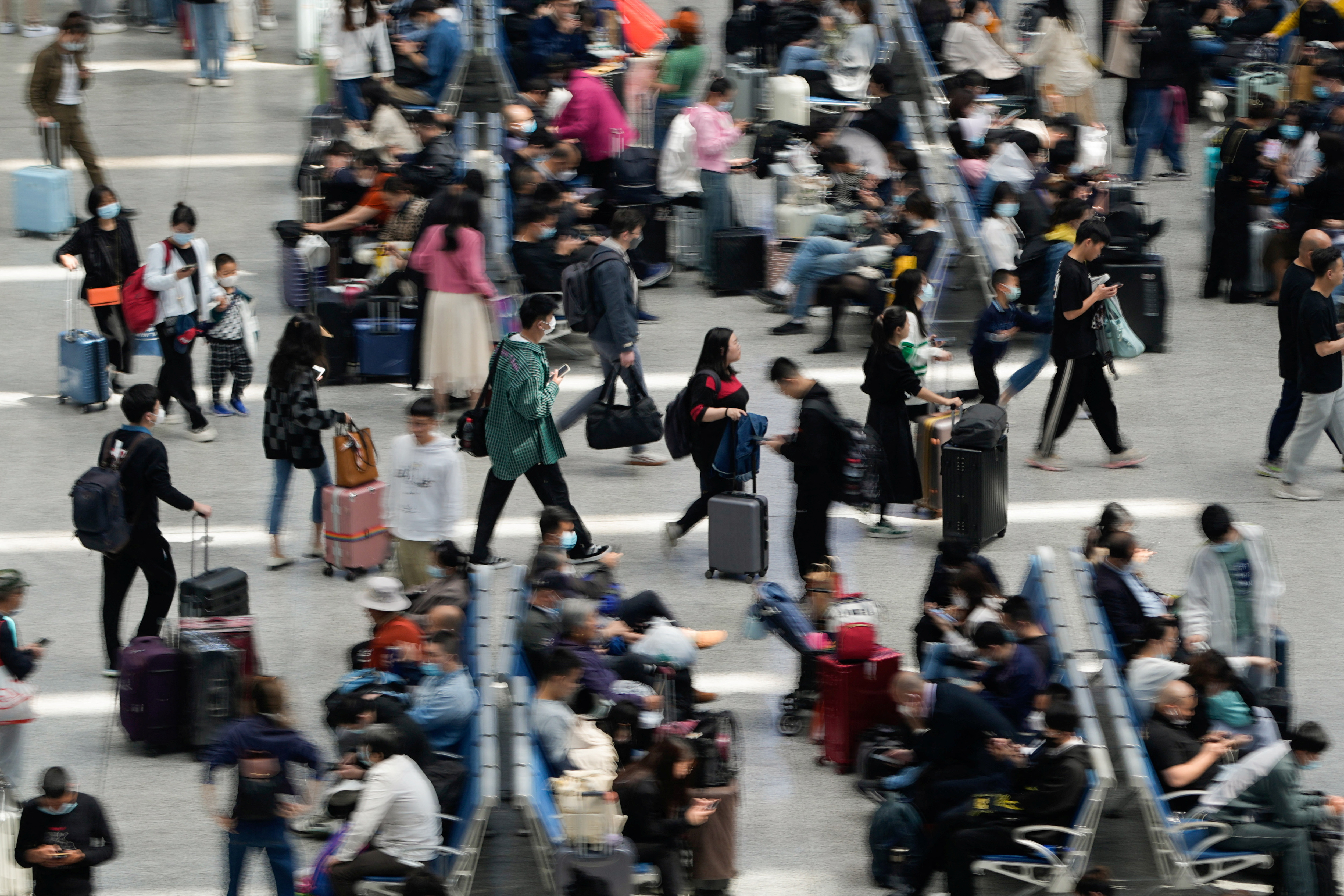 Passengers wait to board trains at Shanghai Hongqiao railway station ahead of the five-day Labor Day holiday, in Shanghai, China, April 28, 2023. REUTERS/Aly Song