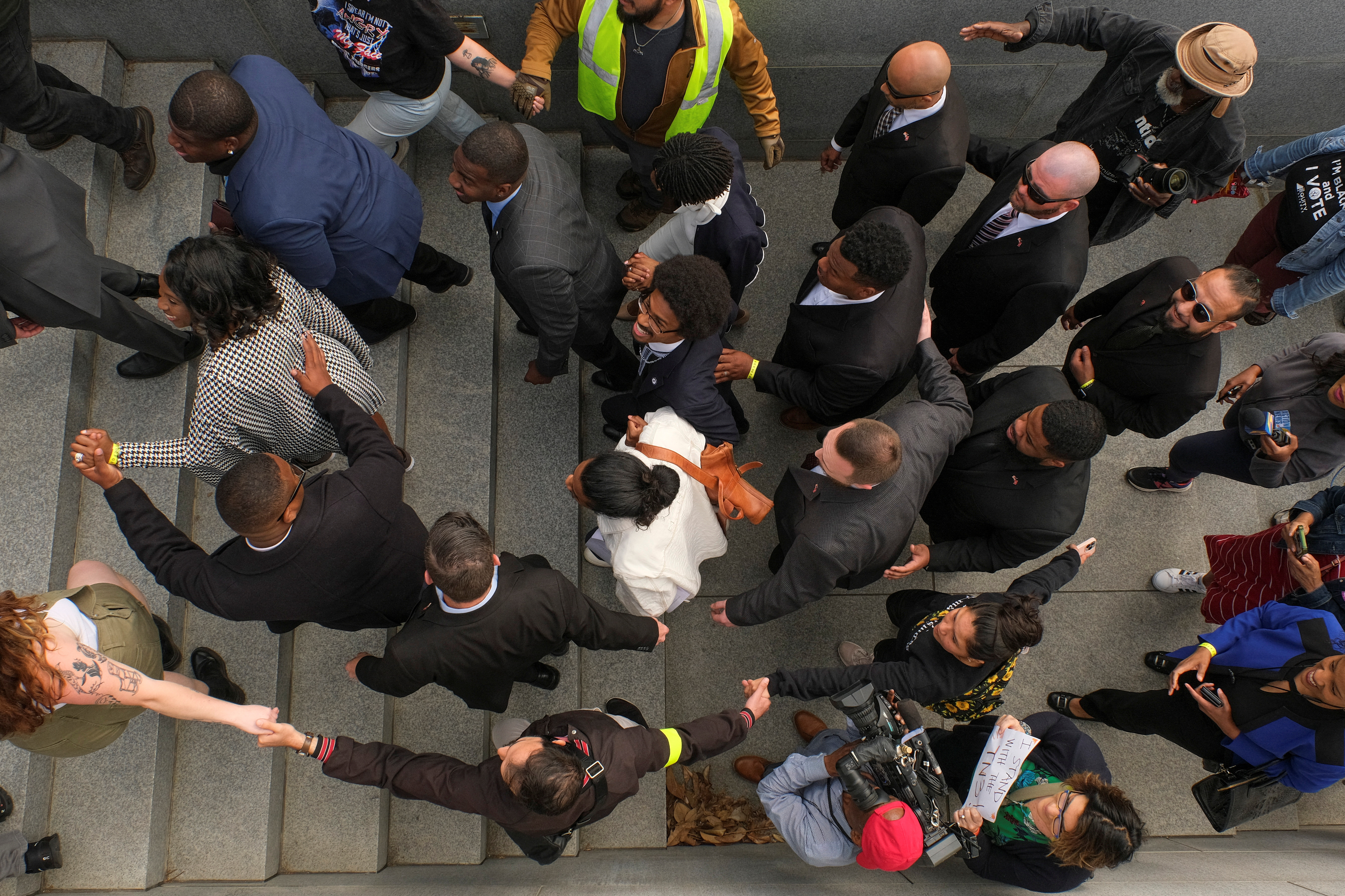Justin Pearson climbs the stairs near the capitol after his reinstatement in Nashville, Tennessee, U.S. April 13, 2023. REUTERS/Kevin Wurm