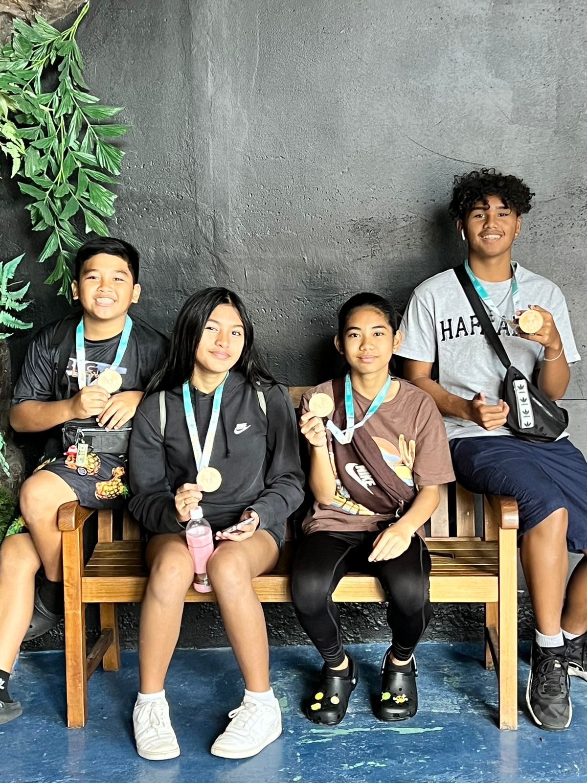 CNMI students display their medals.