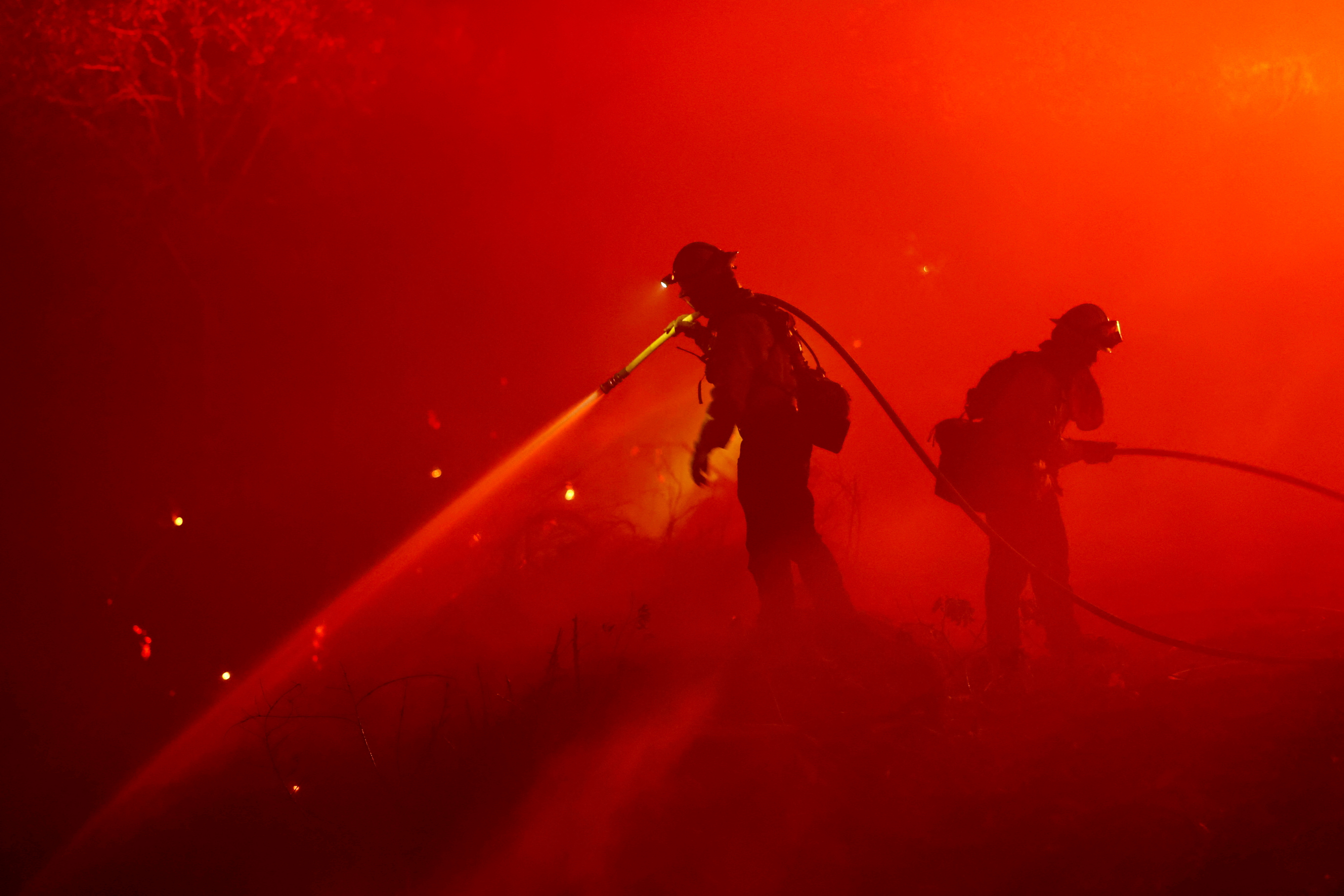 FILE PHOTO: Firefighters work as the Mosquito Fire burns in Foresthill, California, U.S., September 13, 2022. REUTERS/Fred Greaves/File Photo