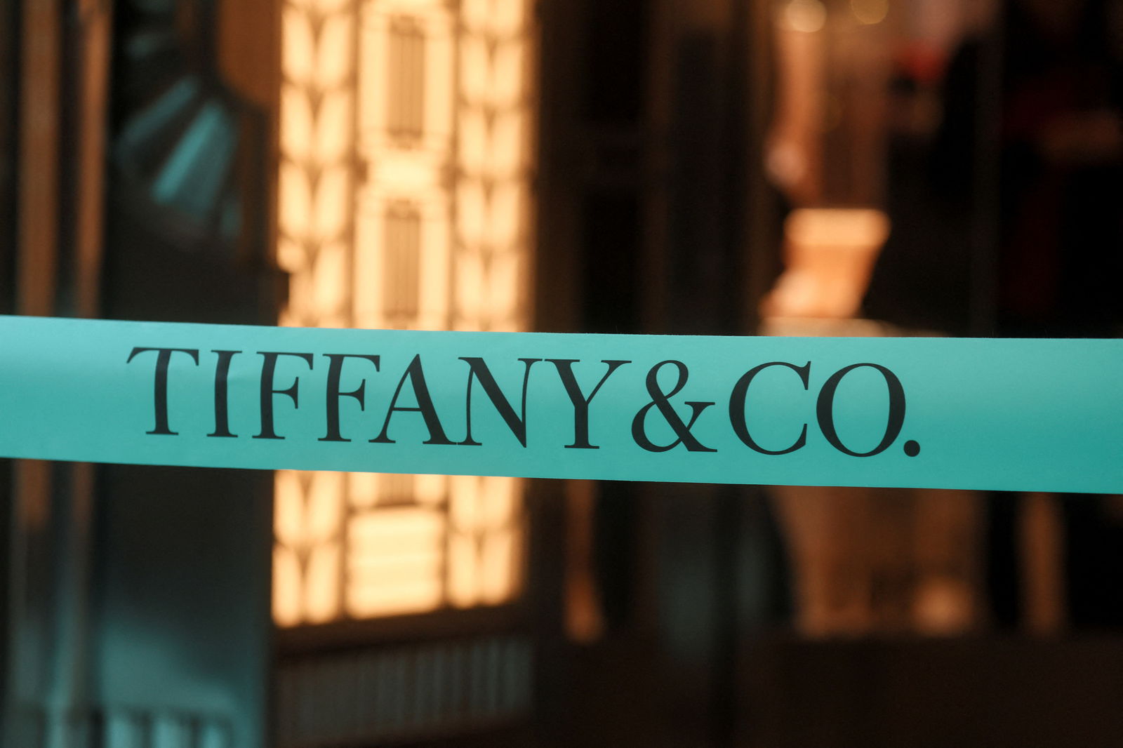 A logo of Tiffany & Co. is seen on a ribbon during a ribbon cutting ceremony for reopening of the Tiffany flagship store on 5th Avenue in Manhattan in New York City, New York, U.S., April 26, 2023. REUTERS/Brendan McDermid