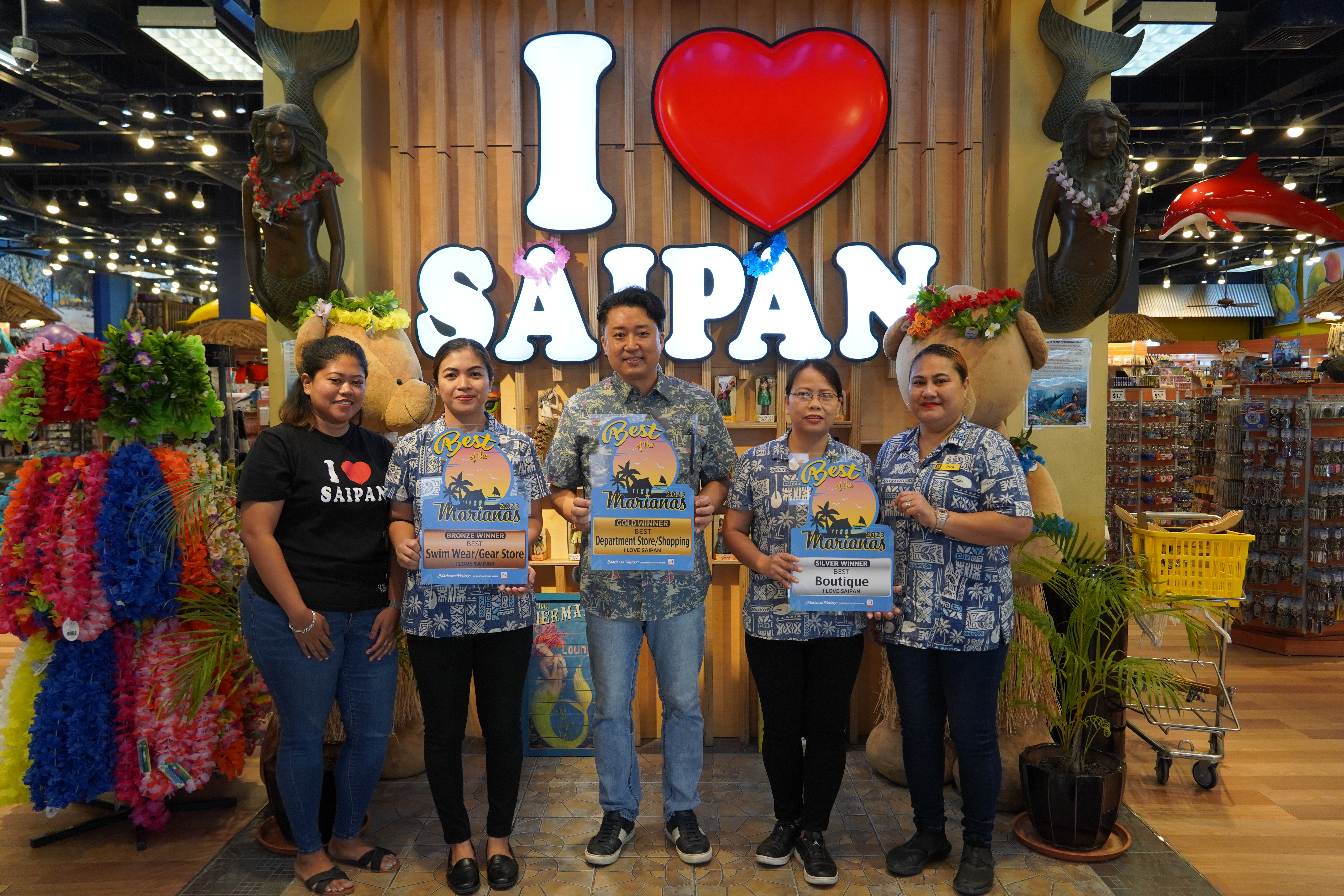 Alex Yuon, center, president of I Love Saipan Stores, Star Sands Plaza, receives the Gold award for Best Department Store/Shopping, Silver for Best Boutique, and Bronze for Best Swim Wear/Gear Store. Also in photo are Careza Sumagpang, left, of marketing; Aiza Gutierrez, second left, team leader-fashion; Graze Esquivel, assistant store manager; and Gayle Pua, team leader.
