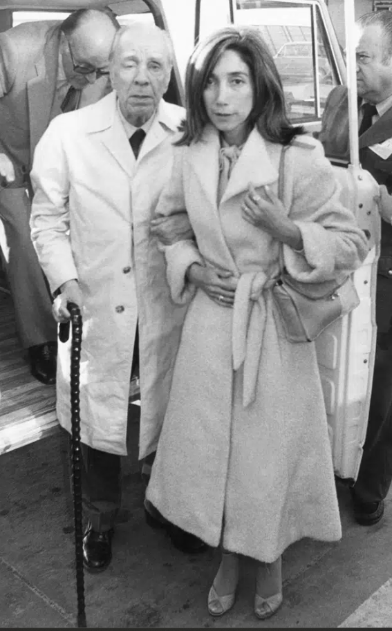 In this April 20, 1980 file photo, Argentine writer Jorge Luis Borges, accompanied by his secretary Maria Kodama, arrives in Madrid, Spain to receive the Spanish literary prize "Miguel de Cervantes."