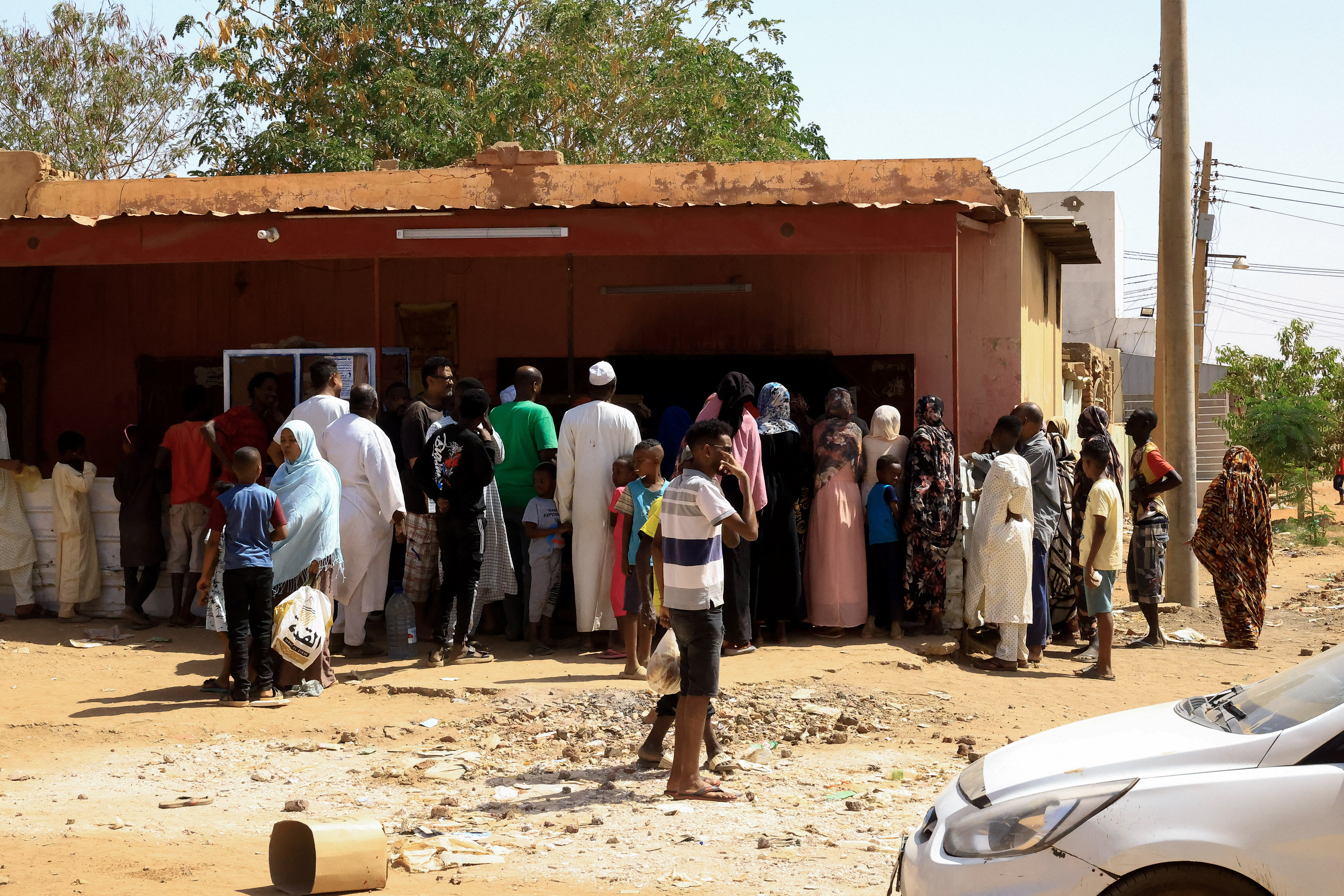 People gather to get bread during clashes between the paramilitary Rapid Support Forces and the army in Khartoum North, Sudan, April 22, 2023. REUTERS/Mohamed Nureldin Abdallah