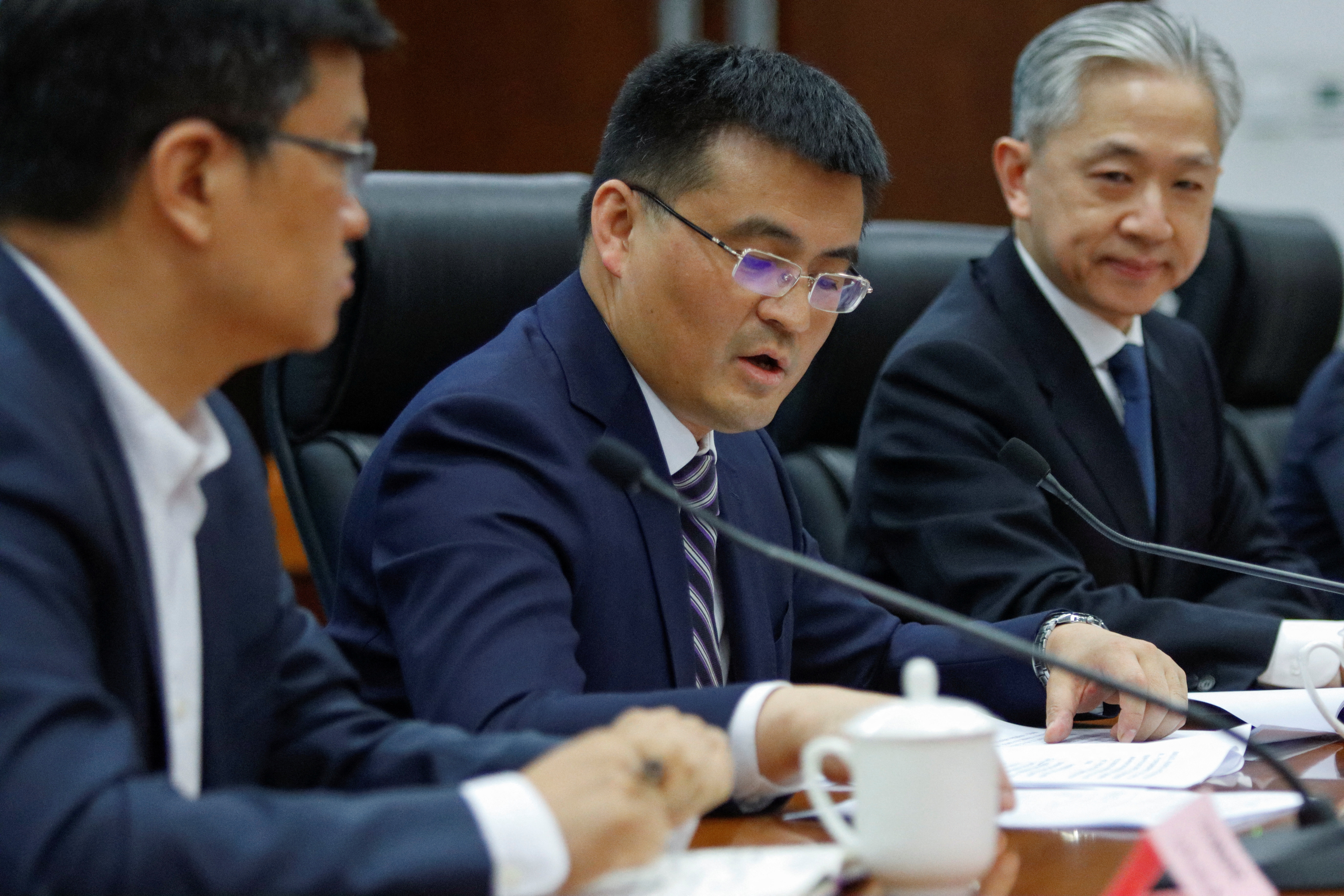 Yu Jun, Deputy Head of Chinese Foreign Ministry's Eurasian department, speaks next to Foreign Ministry spokesperson Wang Wenbin at a new briefing following a phone call between Chinese President Xi Jinping and Ukrainian President Volodymyr Zelenskiy, in Beijing, China April 26, 2023. REUTERS/Florence Lo