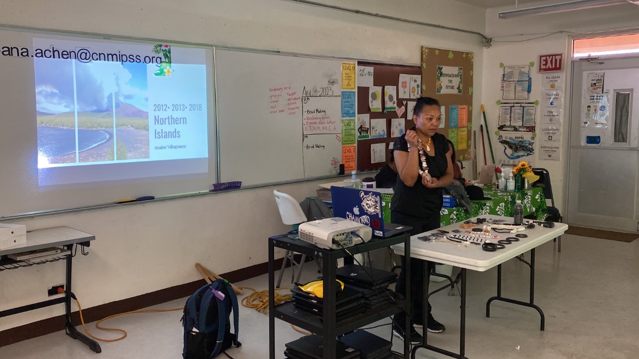Analee Villagomez shows a necklace made from shells she collected in the Northern Islands.