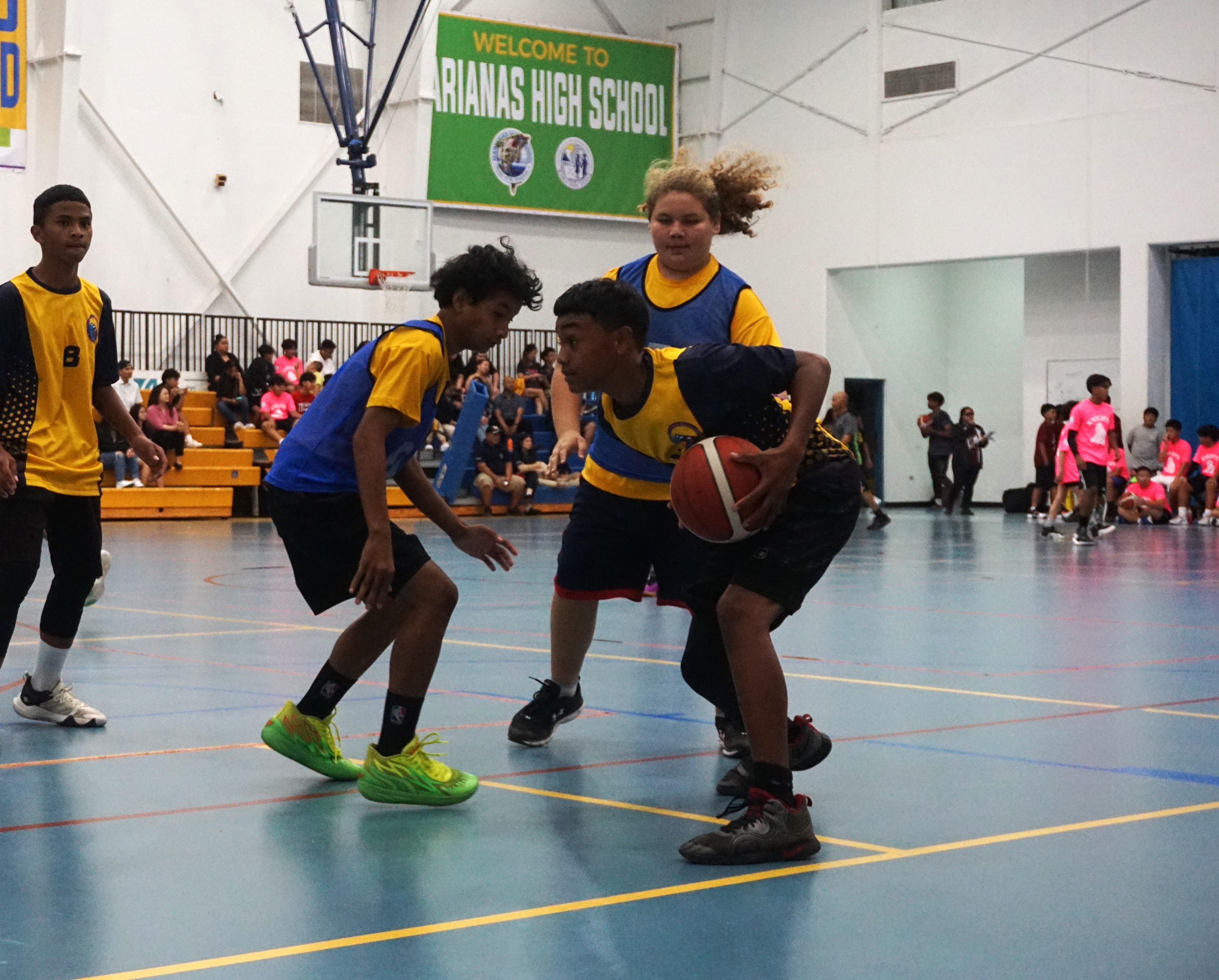 FMS JV's John Rebuenog protects the ball as two HMS JV defenders apply  pressure during a boys middle school division game of the IT&E Interscholastic Basketball League Wednesday at the MHS gym.