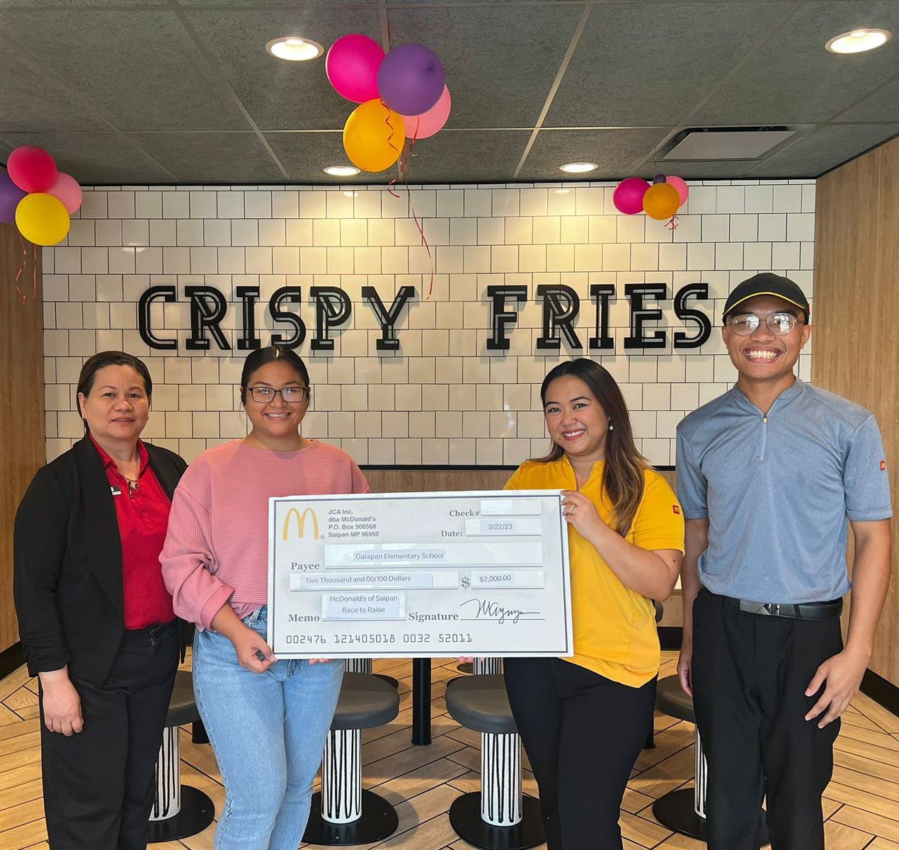 From left, Joyce Asistores, general manager of McDonald’s Chalan Laulau; Jaclyn Quitugua, vice principal of Garapan Elementary School; Mable A. Glenn, Executive assistant to the president, McDonald’s of Guam and Saipan; and John Michael Navarro, 2022 McDonald’s Chalan Laulau Employee of the Year.