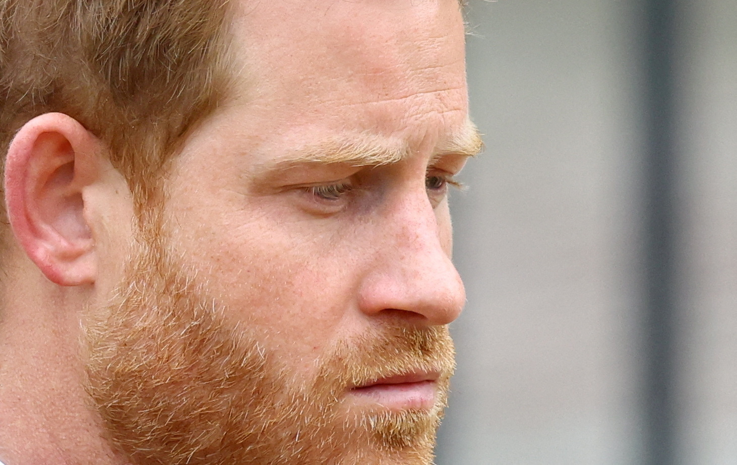 FILE PHOTO: Britain's Prince Harry, Duke of Sussex, reacts as he attends the state funeral and burial of Britain's Queen Elizabeth, in London, Britain, September 19, 2022. REUTERS/Hannah McKay/Pool/File Photo