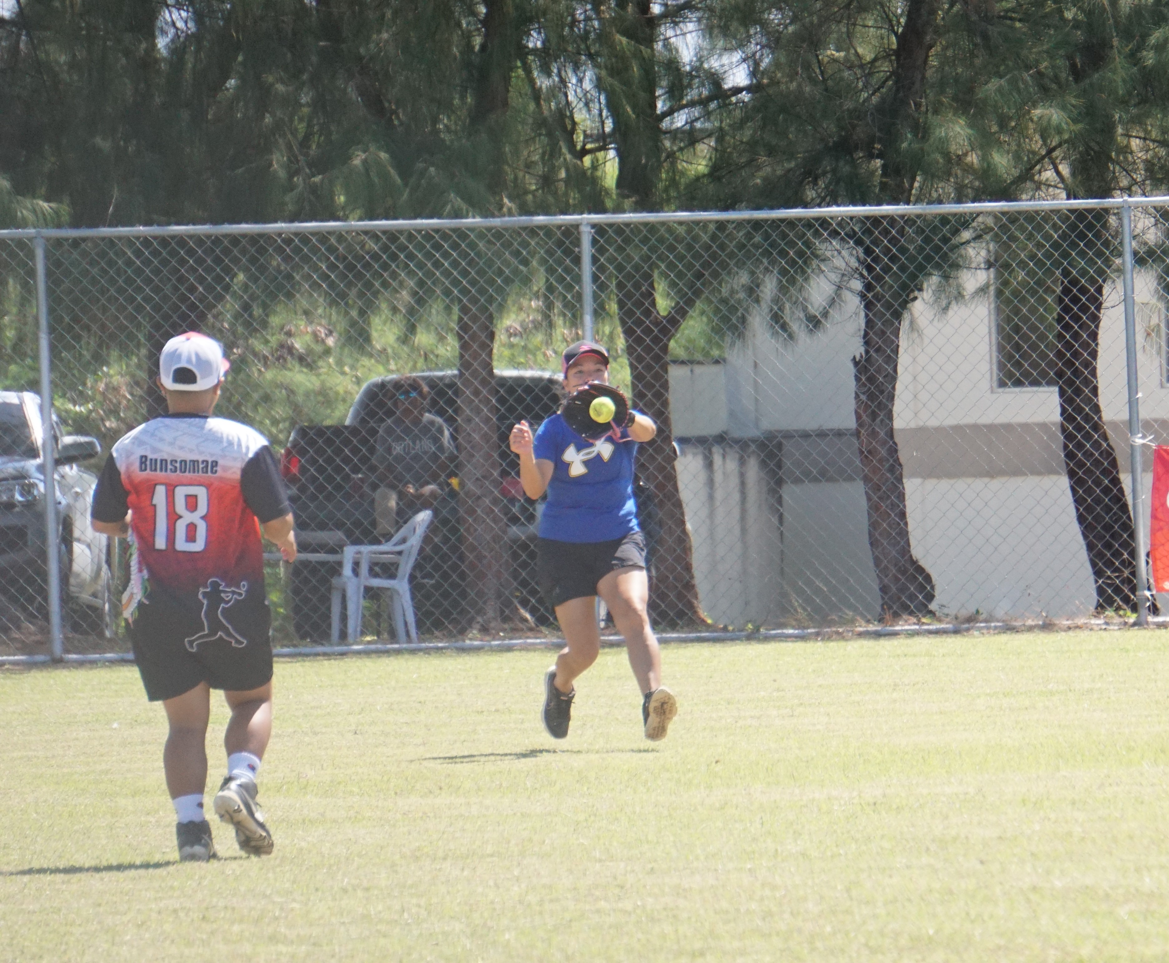 Lady Blue Jays centerfielder Rachel Salalila secures the line drive during a ladies division game of the 2023 Budweiser Belau Amateur Softball League at the Dandan baseball field on Sunday.