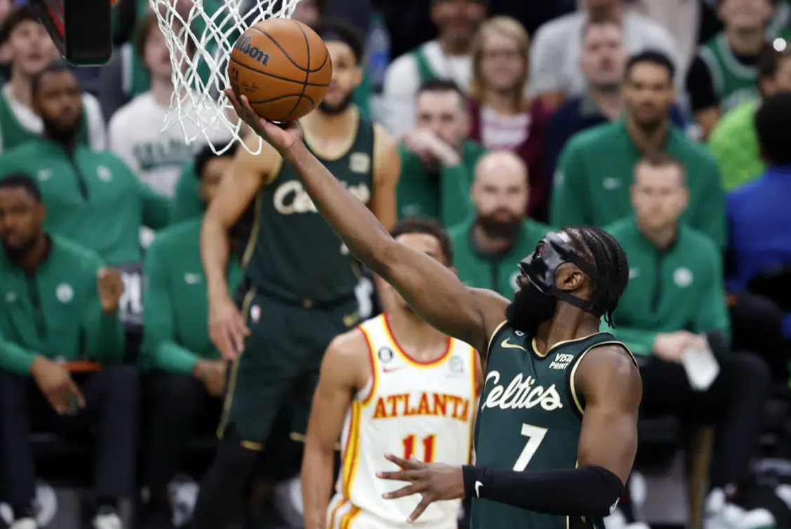 Boston Celtics' Jaylen Brown (7) shoots in front of Atlanta Hawks' Trae Young (11) in the first half during Game 1 in the first round of the NBA basketball playoffs, Saturday, April 15, 2023, in Boston.