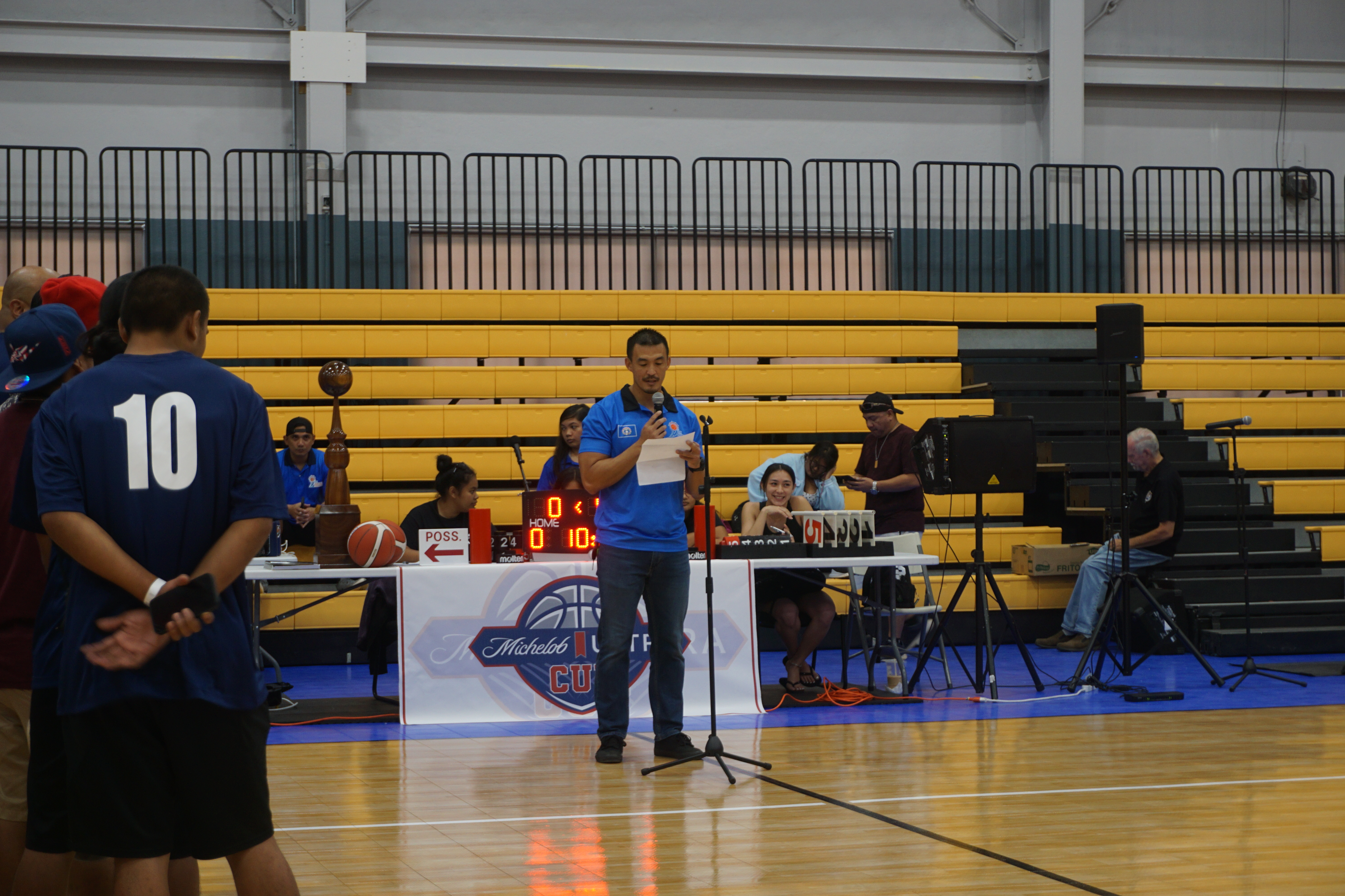NMI Basketball Federation President James Lee reads his speech.