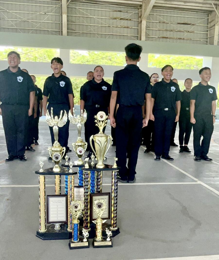 The Dr. Rita Hocog Inos Junior-Senior High School Leadership Corps team in formation.
