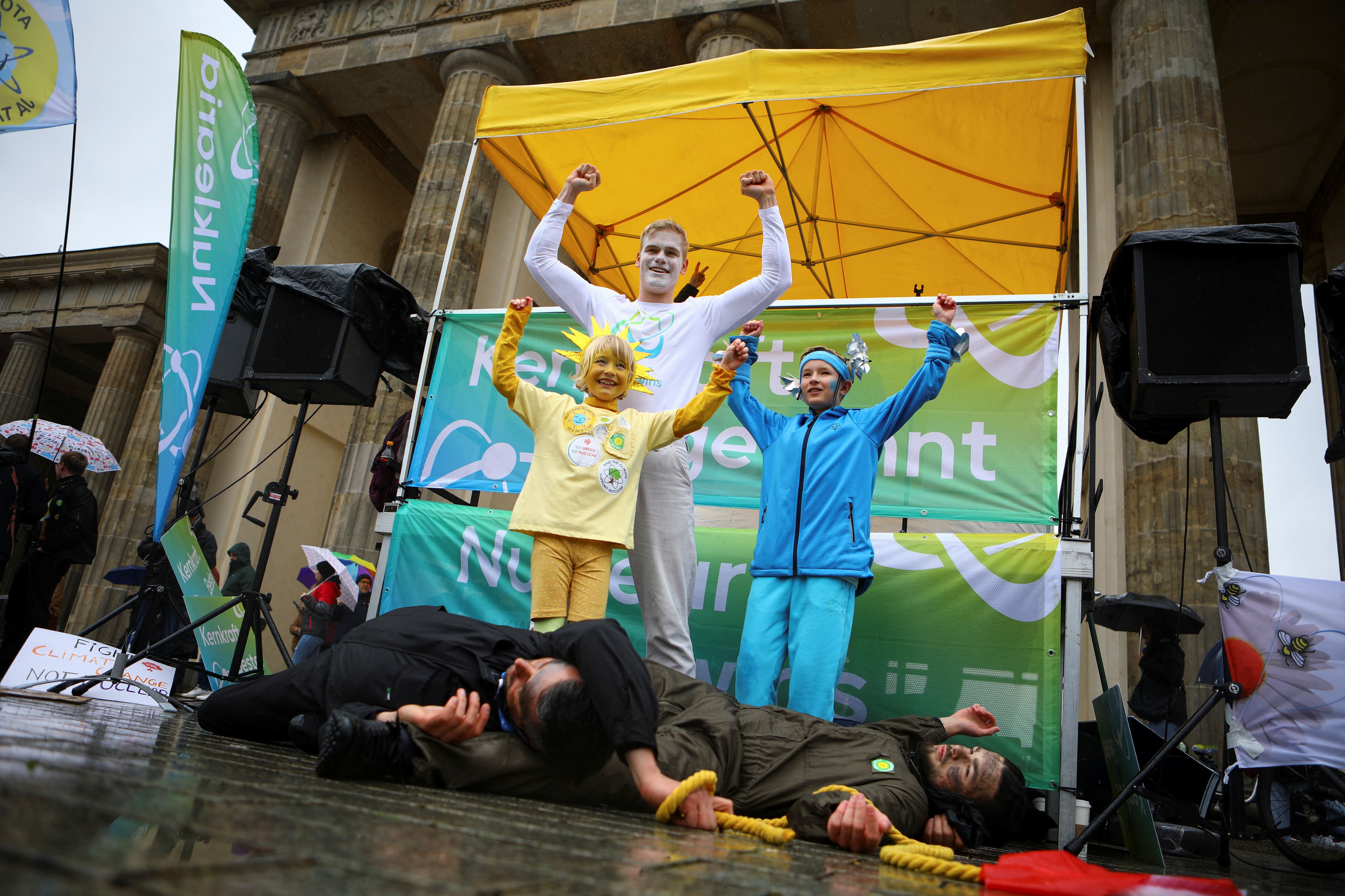 People take part in a performance to demonstrate nuclear power winning against coal, during a protest against the shut down of the last three German nuclear power plants, in Berlin, Germany, April 15, 2023. REUTERS/Nadja Wohlleben