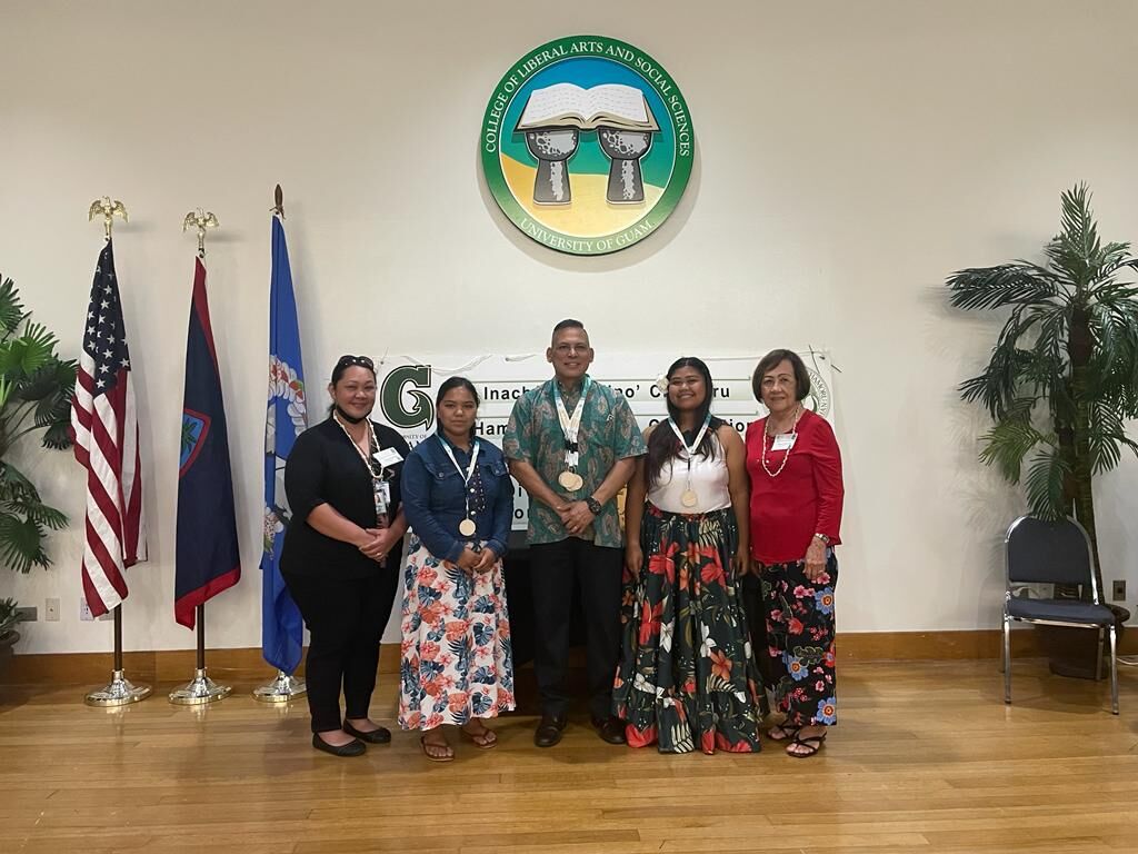 CCLHS Program Director Jonas Barcinas with Chacha Oceanview Middle School and Tinian High School’s representatives during the oratorical medal presentation.