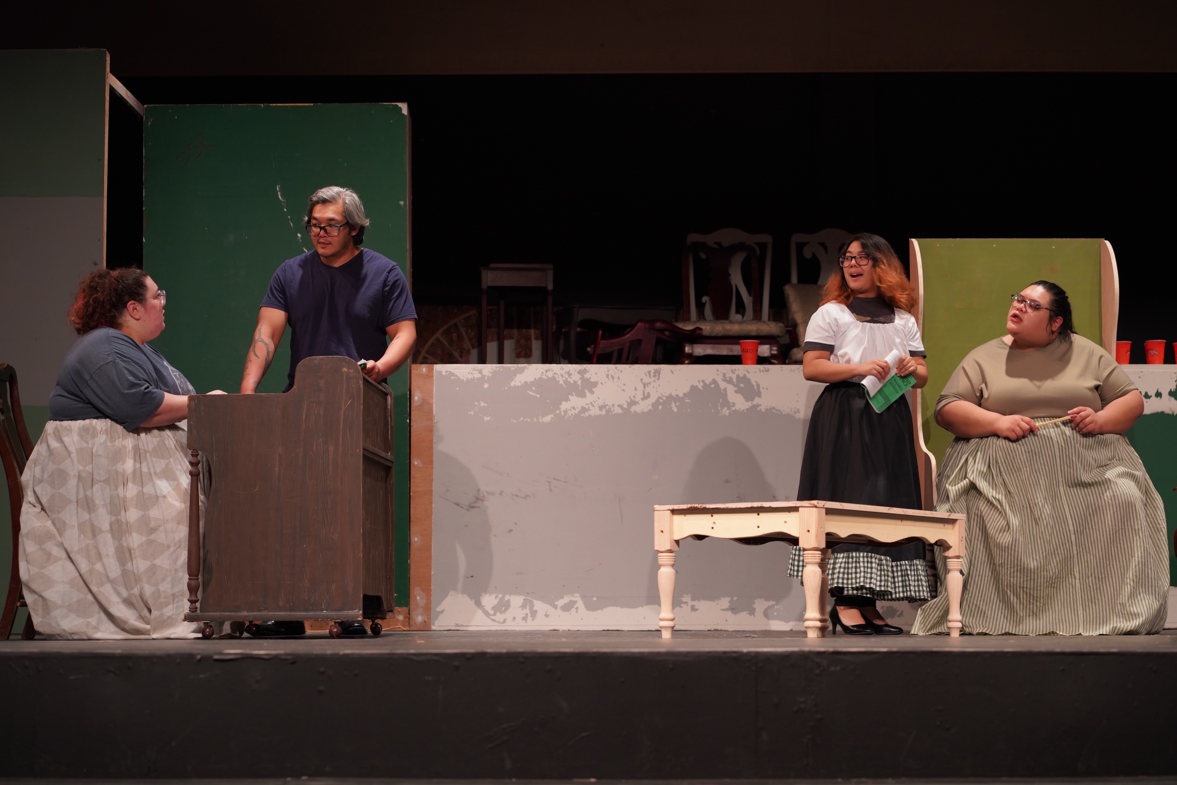 Ånna Prelosky, Nicolas Quinata, Jauria Camacho, and Athena Meno practice their roles as Lizzy, Mr. Darcy, Charlotte Lucas, and Lady Catherine de Bourgh, respectively, on April 4, 2023, at the University of Guam Fine Arts Theatre.