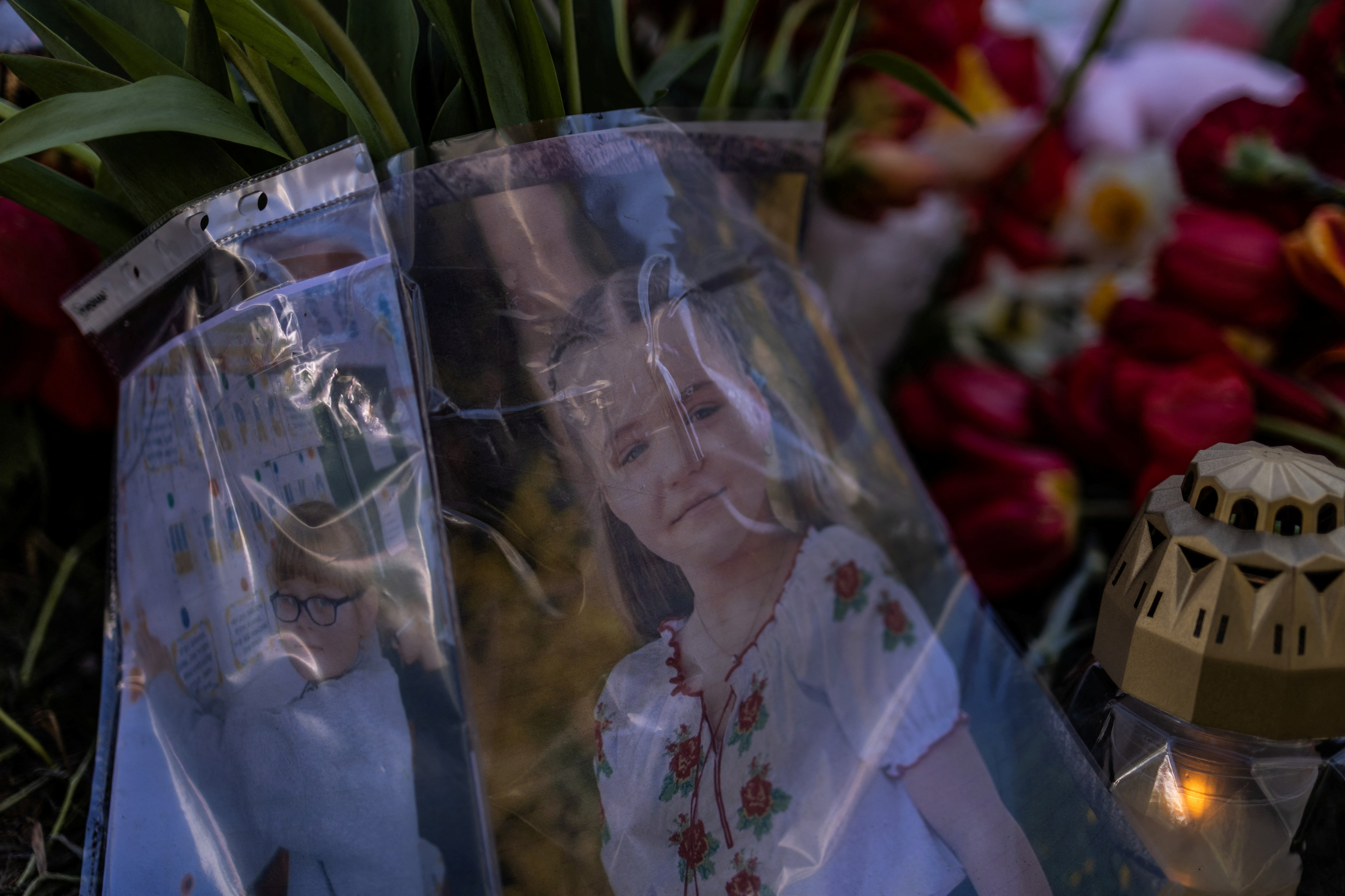 Pictures of Sofia and Alina, two young children killed yesterday by a Russian missile strike, amid Russia's attack on Ukraine, are seen at a strike site in the town of Uman, Cherkasy region, Ukraine April 29, 2023. REUTERS/Carlos Barria