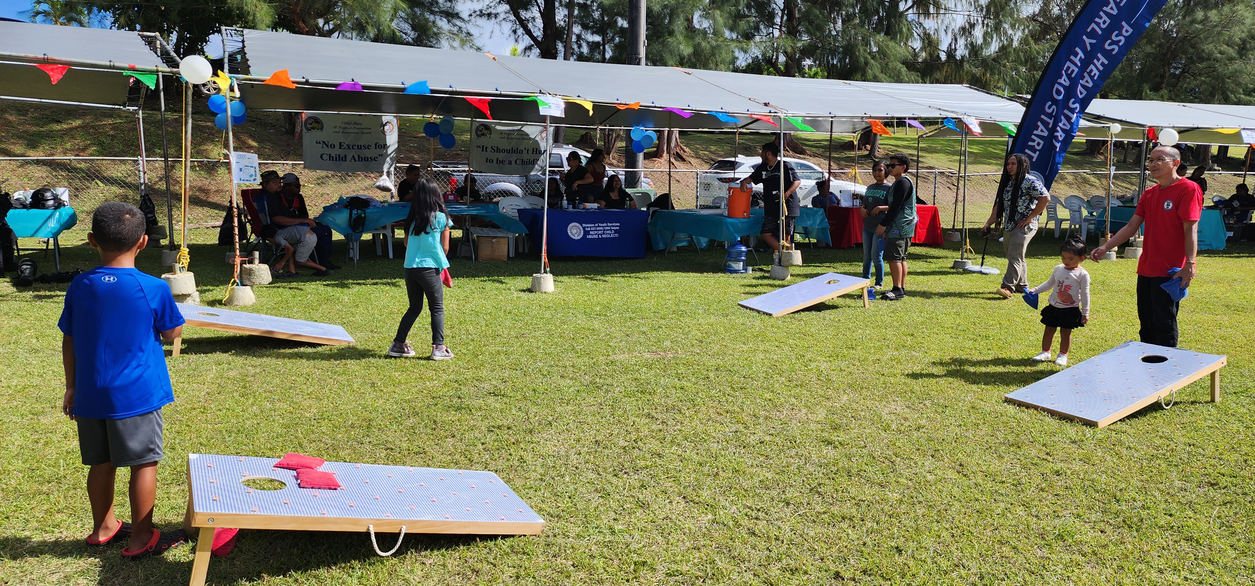 Families enjoy playing games during the Safe, Aware, Free Empower Jamboree at the Capital Hill softball field on Saturday.
