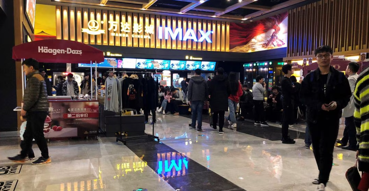 People wait for a movie screening at an IMAX theater inside the Wanda Plaza in Xinxiang, Henan province, China on March 23, 2018. 