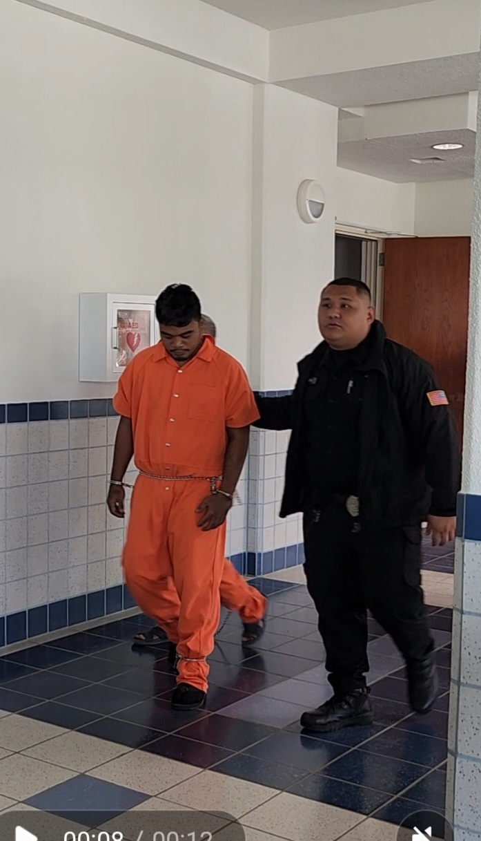 KC Tammy is escorted by a Corrections officer at the Guma Hustisia on Monday.