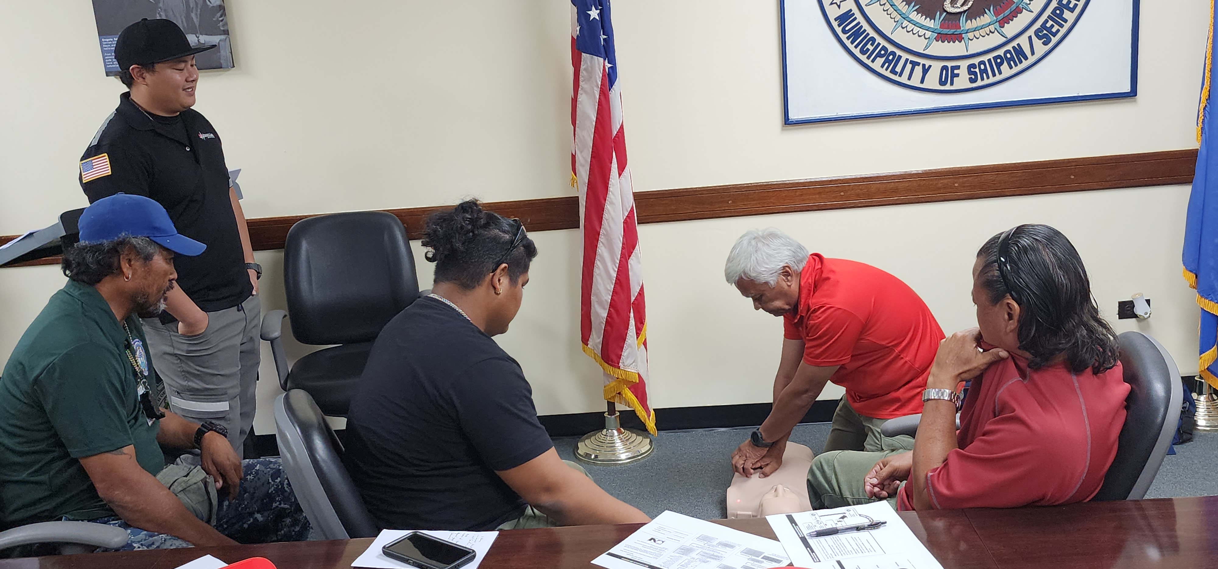 A Priority Care staff member conducts CPR training for Saipan Mayor's Office employees.