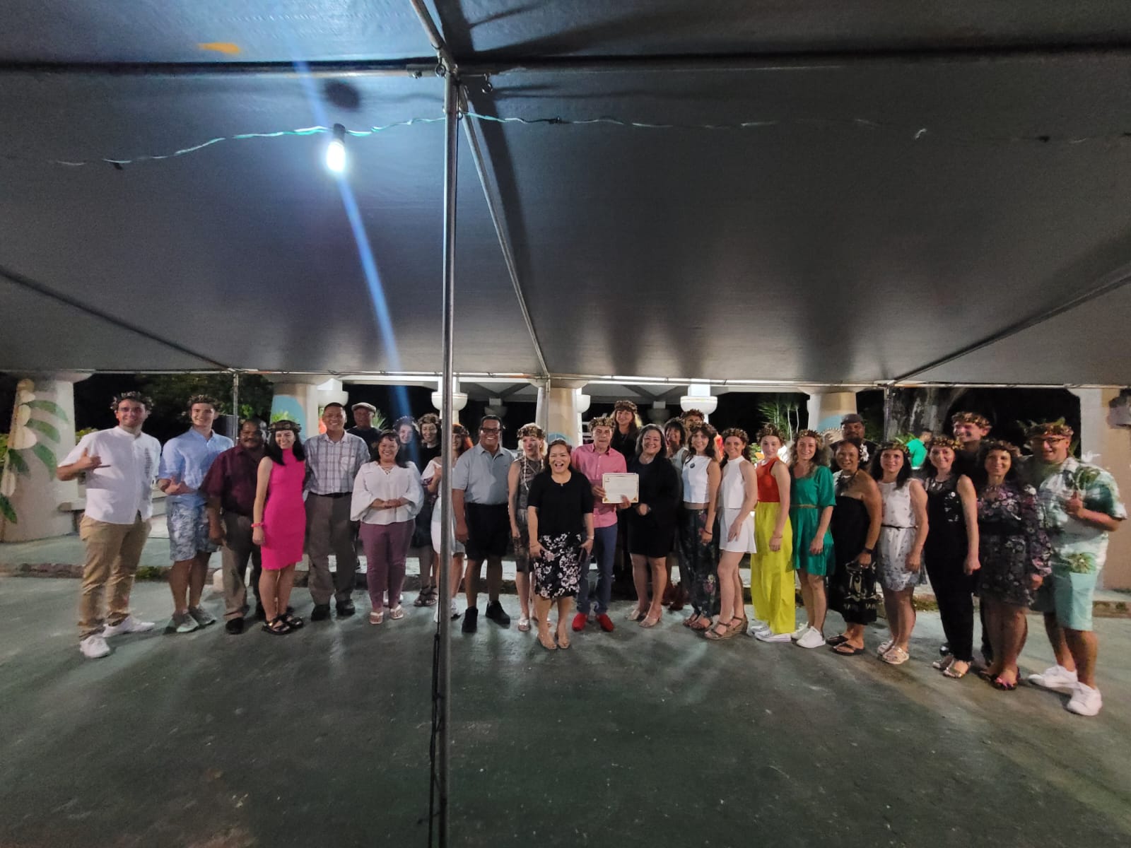 Members of Sofia-6, a Bulgarian folk-dance ensemble, pose with their local hosts during a farewell dinner at the Carolinian Affair’s Office beach pavilion on Tuesday night.