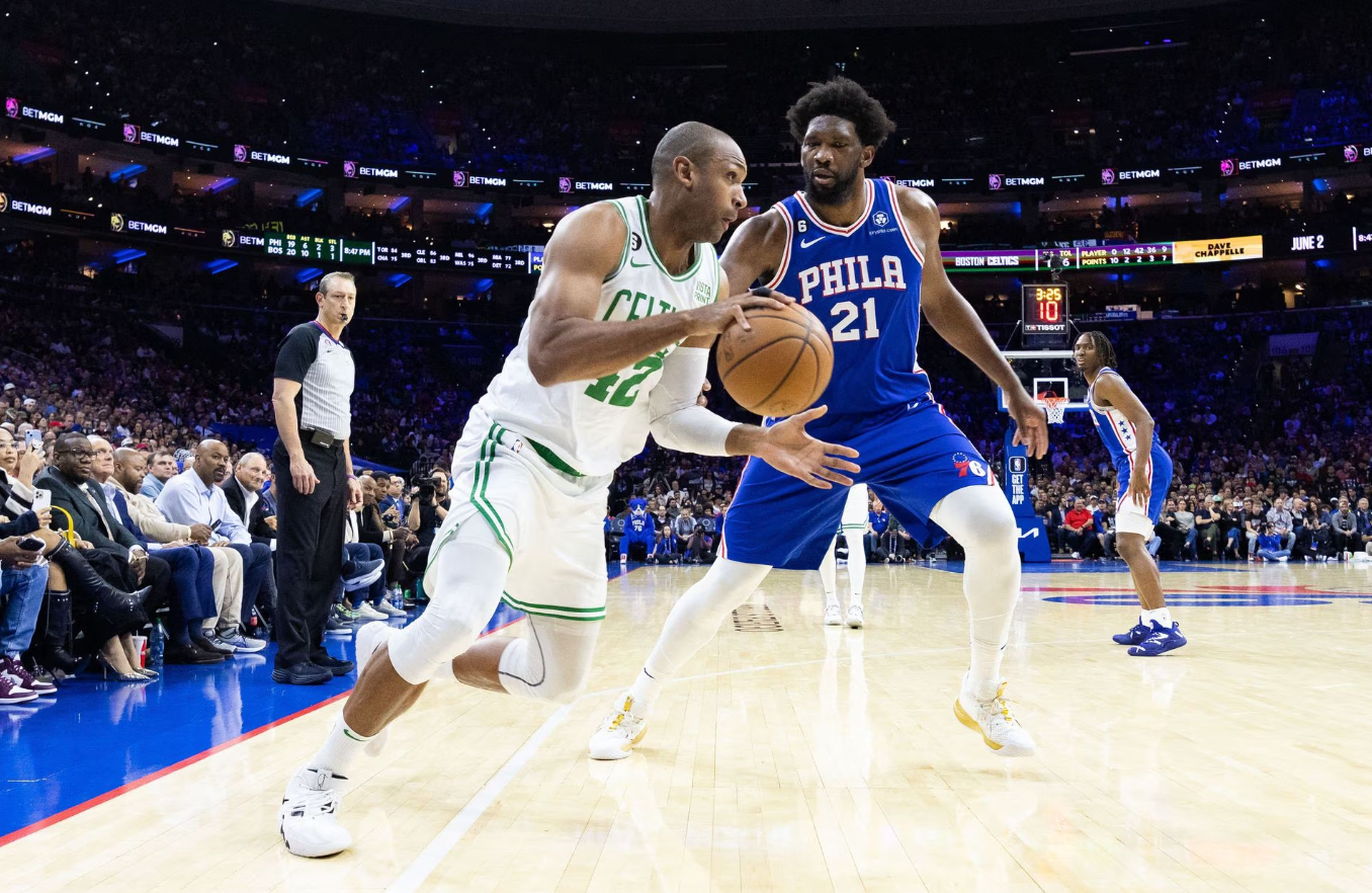 Boston Celtics center Al Horford (42) drives against Philadelphia 76ers center Joel Embiid (21) during the second quarter at Wells Fargo Center in Philadelphia, Pennsylvania, April 4, 2023.