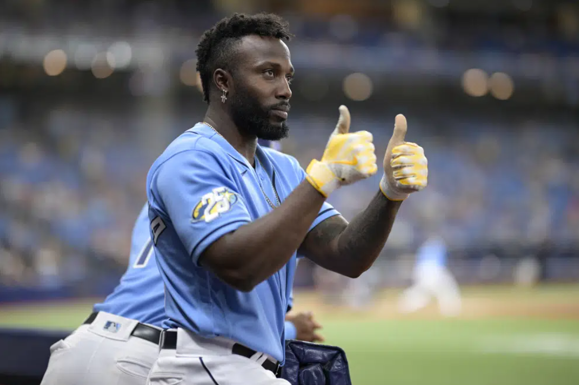 Tampa Bay Rays' Randy Arozarena acknowledges the crowd from the dugout after hitting a two-run home run during the eighth inning of a baseball game against the Oakland Athletics, Saturday, April 8, 2023, in St. Petersburg, Fla.